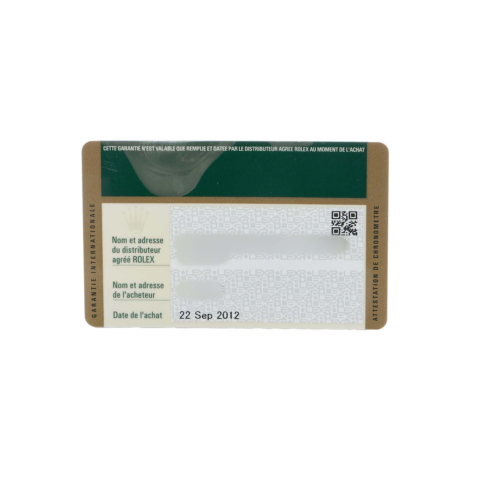 The image shows a Rolex Submariner 116610 Men's Stainless Steel Black Dial warranty card from a top-down angle, displaying purchase details and brand information.