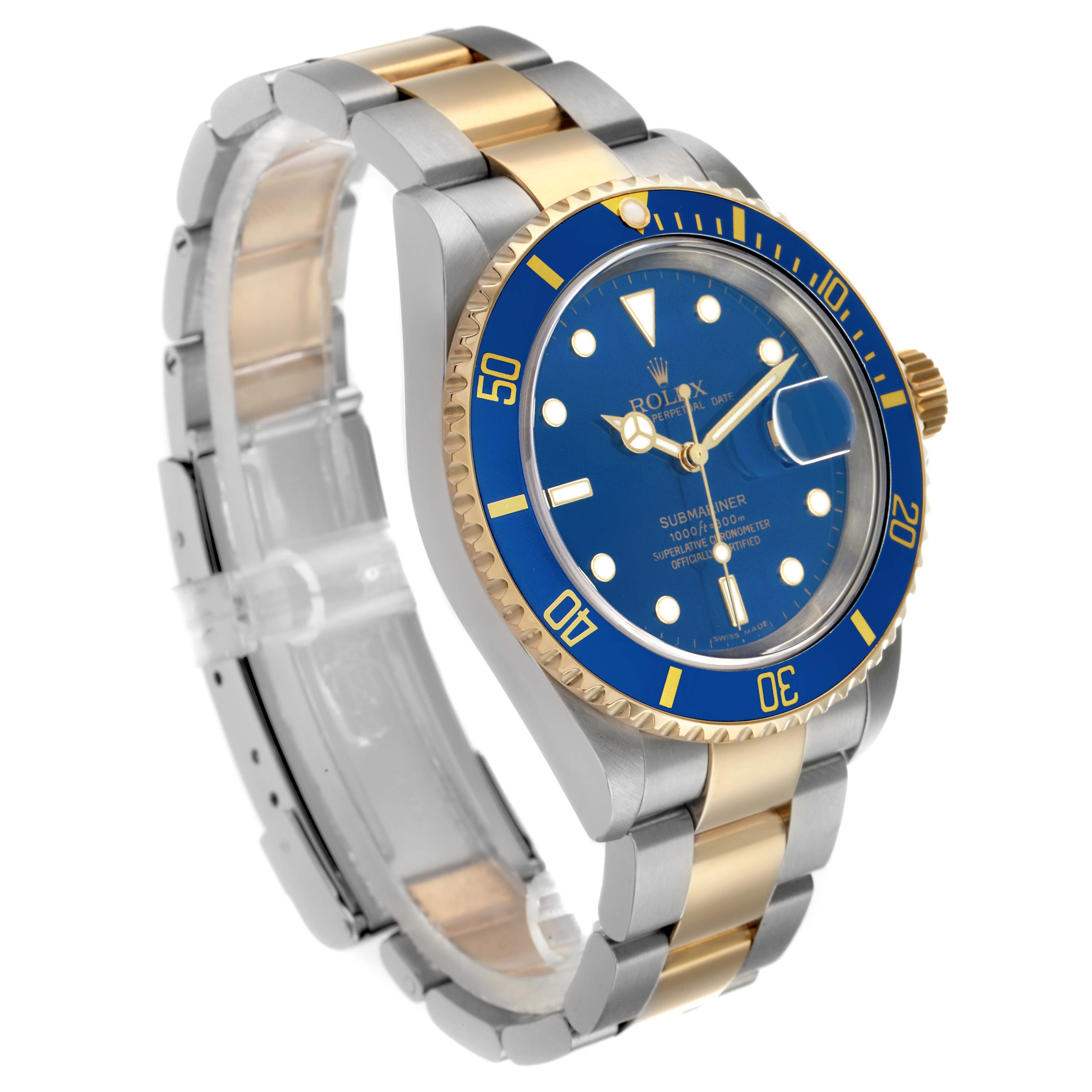 The Rolex Submariner 16613 Men's Steel and Gold (two tone) Blue Dial is shown at a three-quarter angle, highlighting the bezel, dial, and bracelet.