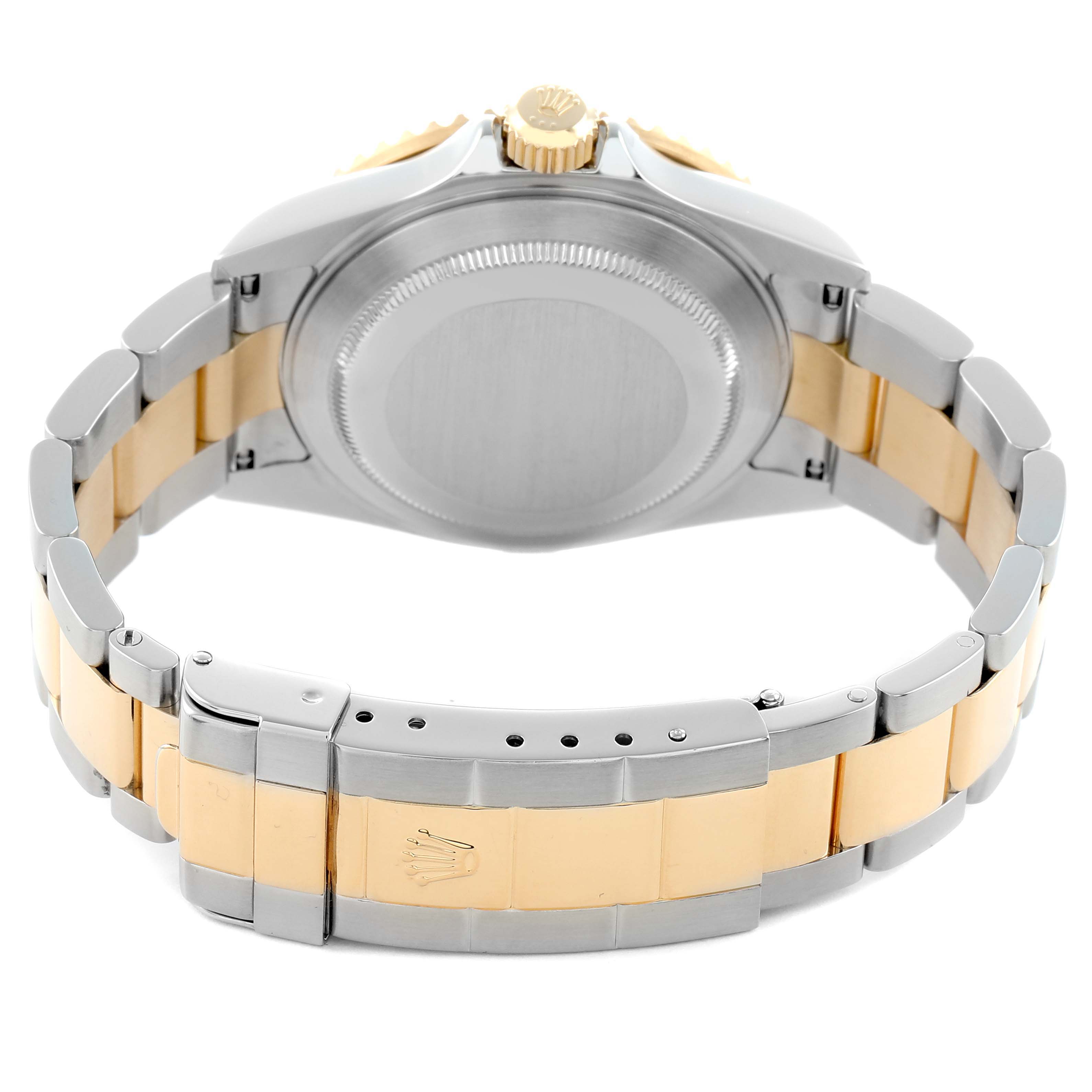 The image shows the back of a Rolex Submariner 16613 Men's Steel and Gold (two tone) Blue Dial watch at an angle highlighting the clasp, bracelet, case back, and crown.