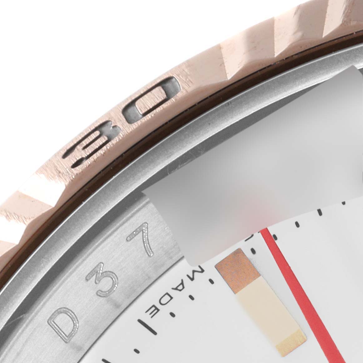 This image shows a close-up angle of the bezel and part of the dial of a Rolex Turn-o-Graph 116261 Men
s Steel and Gold (two tone) White Dial 116261 Men
s Steel and Gold (two tone) White Dial watch.