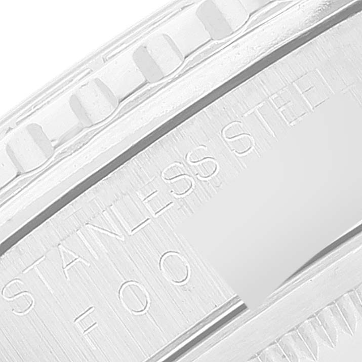 This close-up image shows the side of a stainless steel Rolex Turn-o-Graph 16264 Men's Stainless Steel Silver Dial 16264 Men's Stainless Steel Silver Dial watch band with part of its engravings.