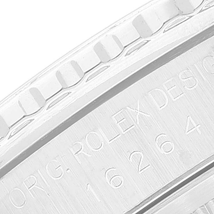 The image shows a close-up of the bezel and part of the case back of a Rolex Turn-o-Graph 16264 Men's Stainless Steel Silver Dial 16264 Men's Stainless Steel Silver Dial watch.