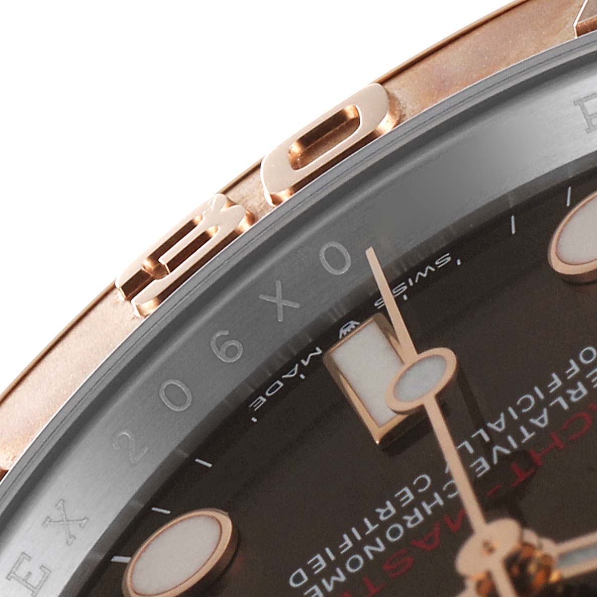 This close-up image of a Rolex Yacht-Master 126621 Men's Steel and Gold (two tone) Brown Dial 126621 Men's Steel and Gold (two tone) Brown Dial watch shows the edge of the bezel and part of the dial.