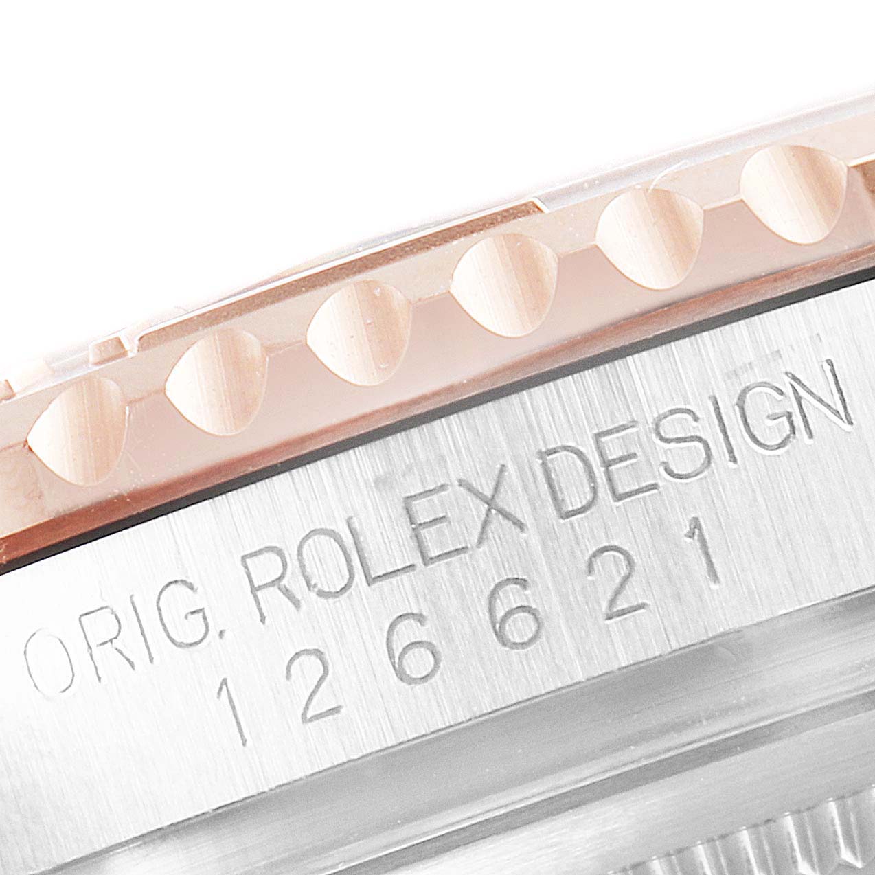 The image shows a close-up of the bezel and part of the case back engraving on a Rolex Yacht-Master 126621 Men's Steel and Gold (two tone) Brown Dial 126621 Men's Steel and Gold (two tone) Brown Dial watch.