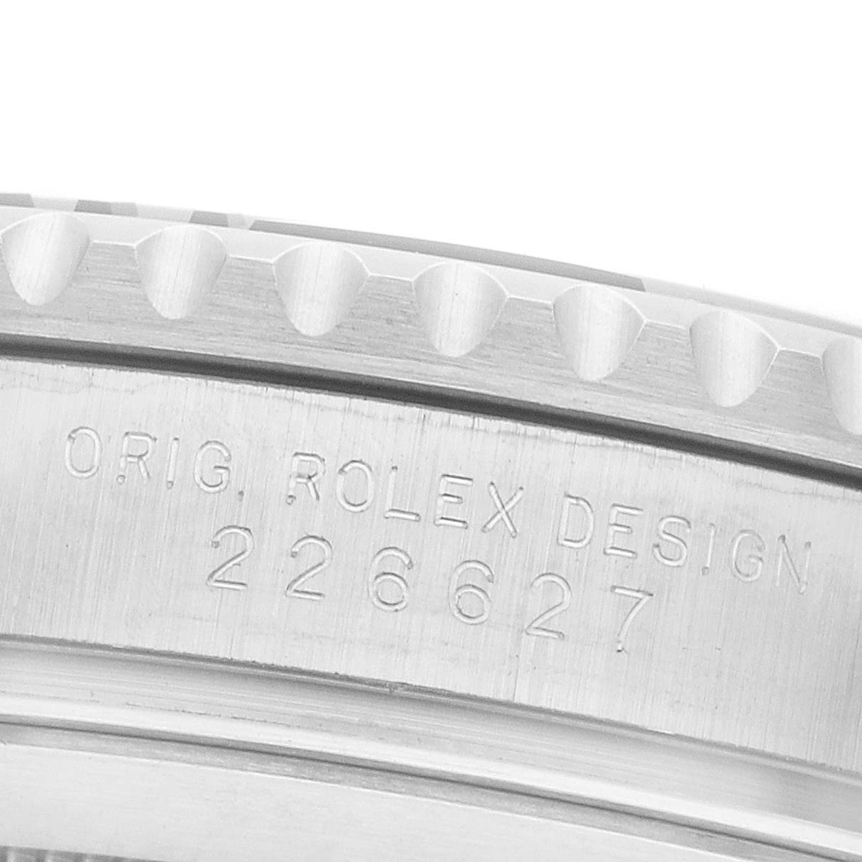 The image shows a close-up of the case side edge with engravings on the Rolex Yacht-Master 226627 Men's Titanium Black Dial watch.