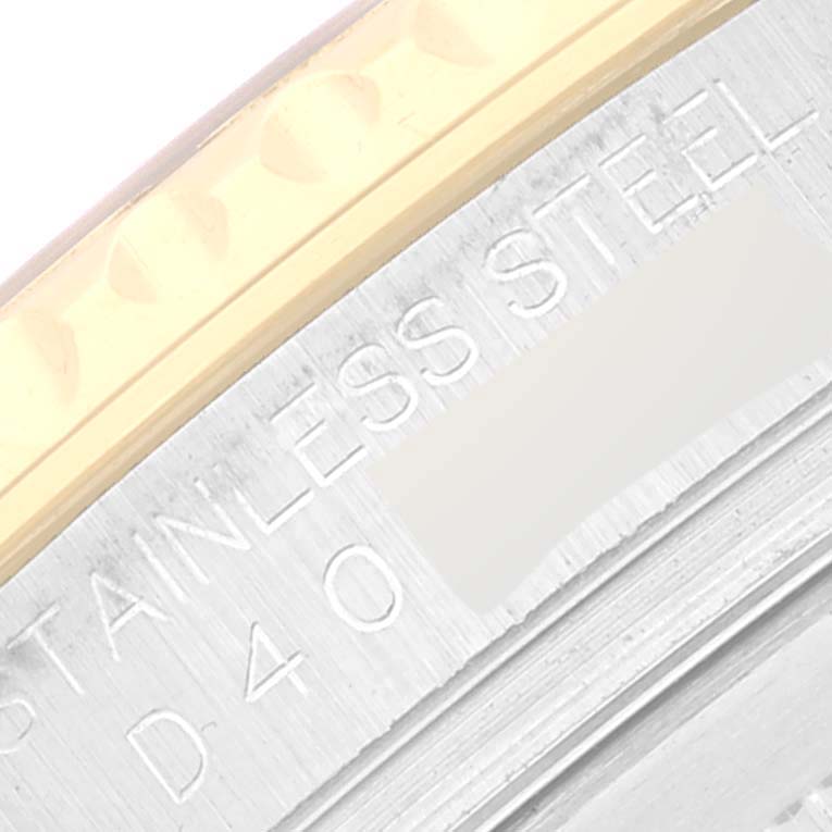 This image shows a close-up of the bezel and text on the case back of the Rolex Yacht-Master 16623 Men's Steel and Gold (two tone) Mother of Pearl Dial 16623 Men's Steel and Gold (two tone) Mother of Pearl Dial watch.
