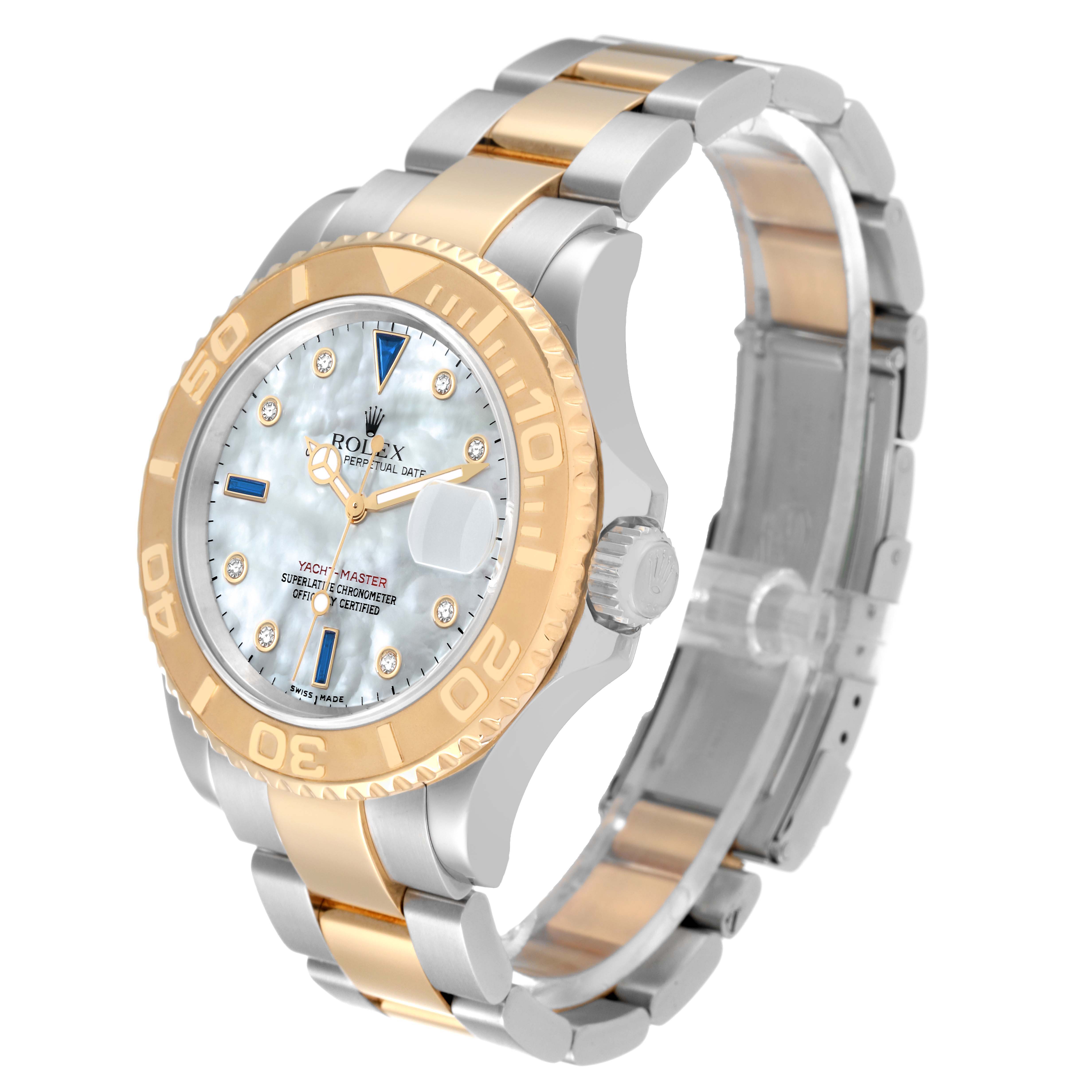The Rolex Yacht-Master 16623 Men's Steel and Gold (two tone) Mother of Pearl Dial 16623 Men's Steel and Gold (two tone) Mother of Pearl Dial watch is pictured at an angle showing the face, bezel, crown, and two-tone bracelet.