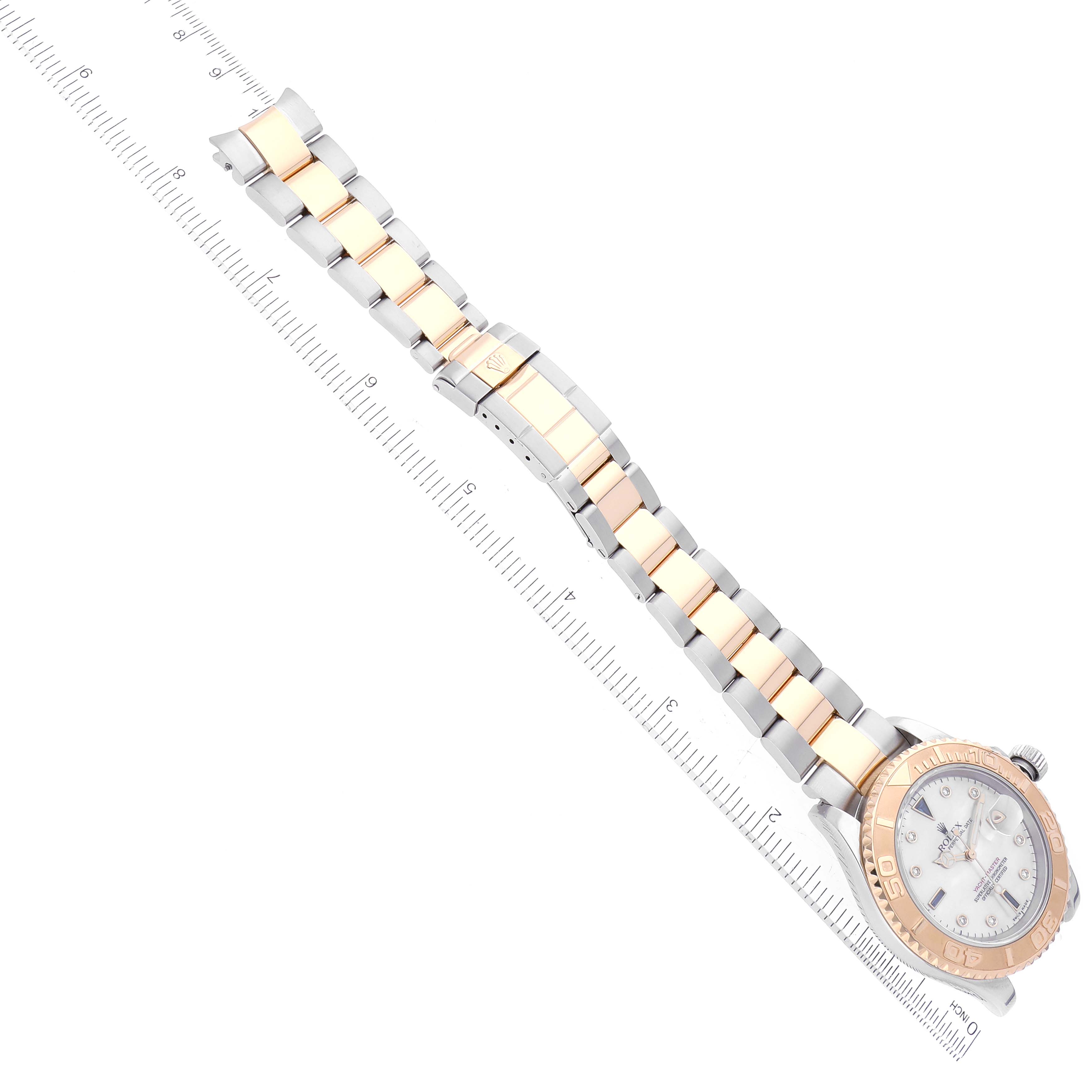 The image shows a Rolex Yacht-Master 16623 Men's Steel and Gold (two tone) Mother of Pearl Dial 16623 Men's Steel and Gold (two tone) Mother of Pearl Dial watch with a bi-metal bracelet, laid flat next to a ruler.