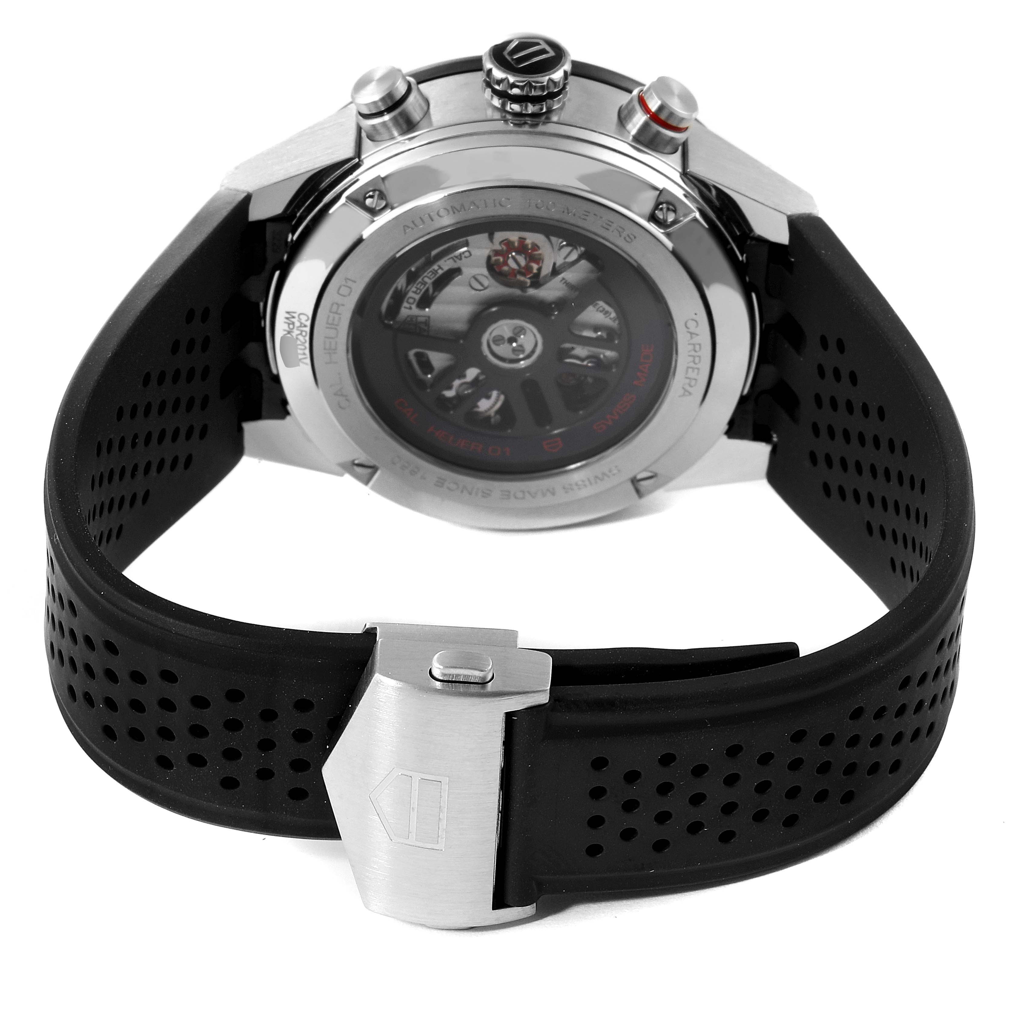 The image shows the back view of a Tag Heuer Carrera CAR201V.BA0714 Men
s Stainless Steel Black Dial CAR201V.BA0714 Men
s Stainless Steel Black Dial watch, featuring the automatic movement and part of the black rubber strap with clasp.