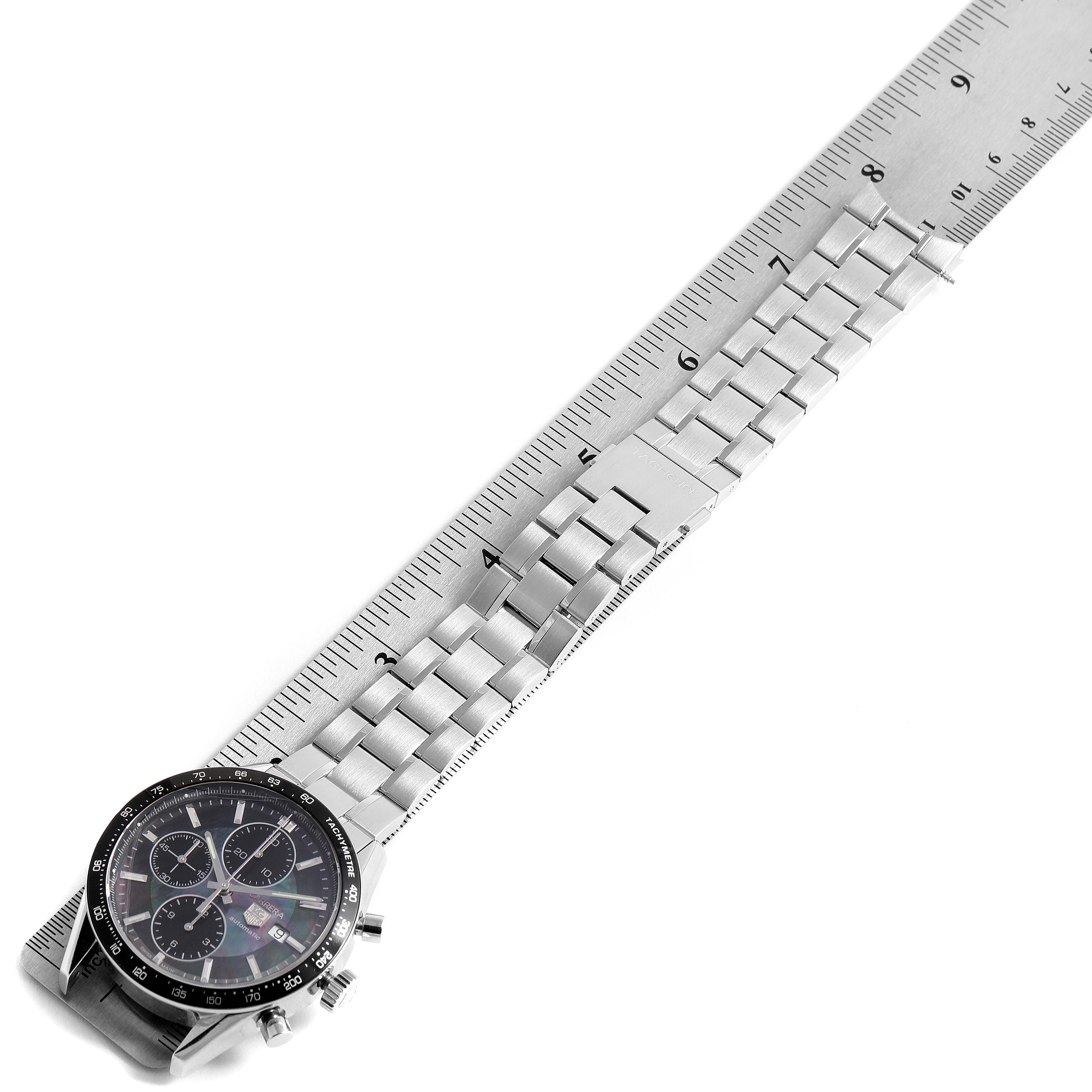 The Tag Heuer Limited Edition CV201K Men's Stainless Steel Mother of Pearl Dial CV201K Men's Stainless Steel Mother of Pearl Dial watch is shown at a slight angle, featuring the face and bracelet aligned with a ruler.