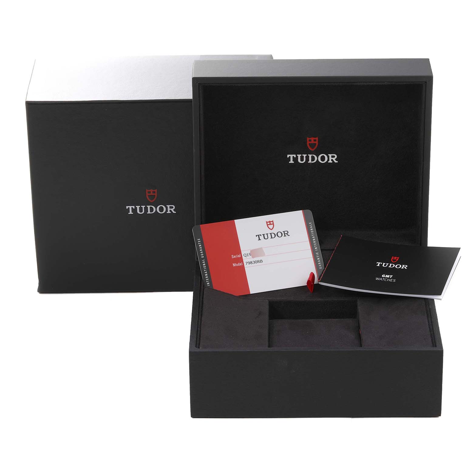 The image shows the Tudor Heritage Black Bay 79830RB Men
s Stainless Steel Black Dial 79830RB Men
s Stainless Steel Black Dial watch box, warranty card, and instruction manual from a frontal angle.