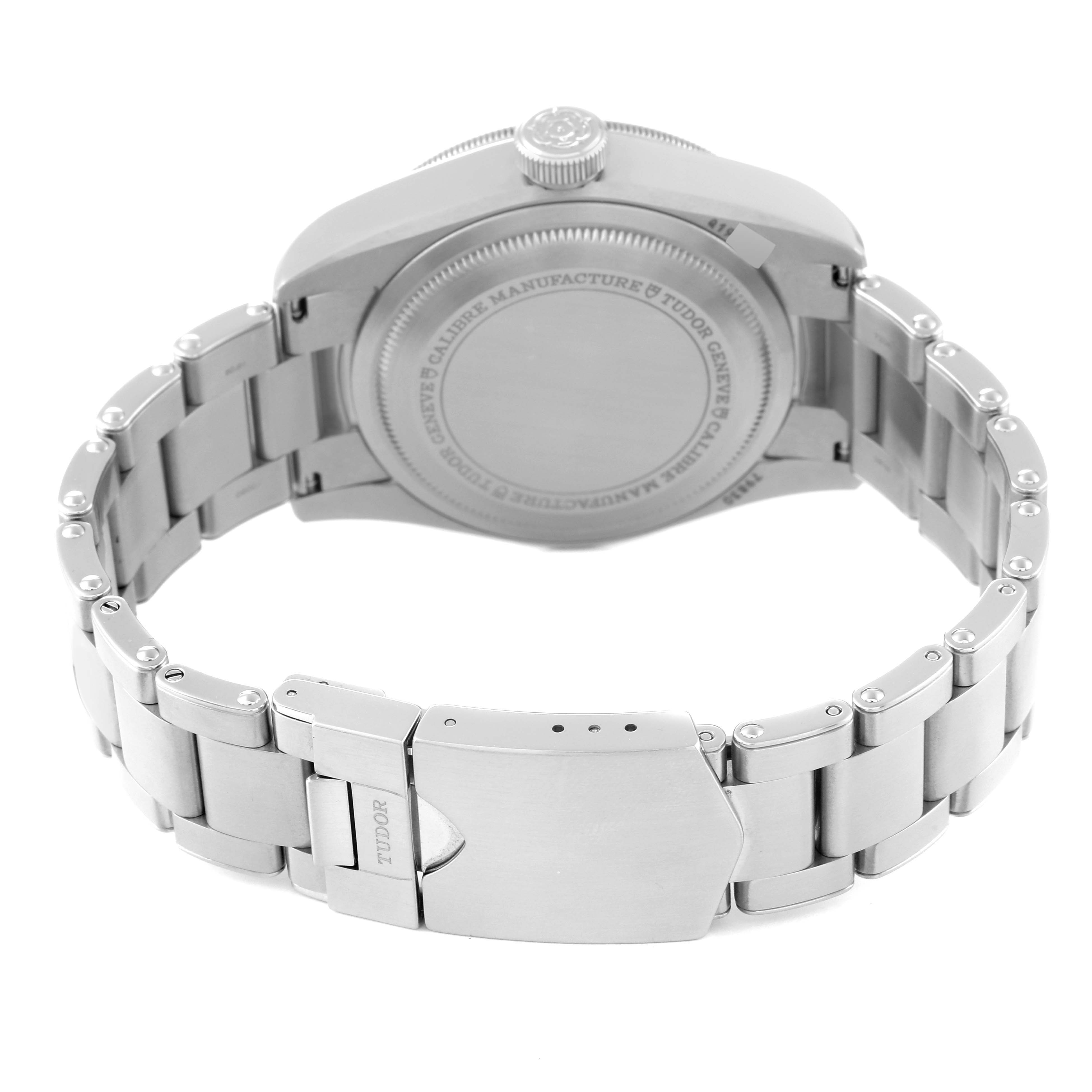 The image shows the back view of a Tudor Heritage Black Bay 79830RB Men
s Stainless Steel Black Dial 79830RB Men
s Stainless Steel Black Dial watch, displaying the case back and part of the metal bracelet with a clasp.