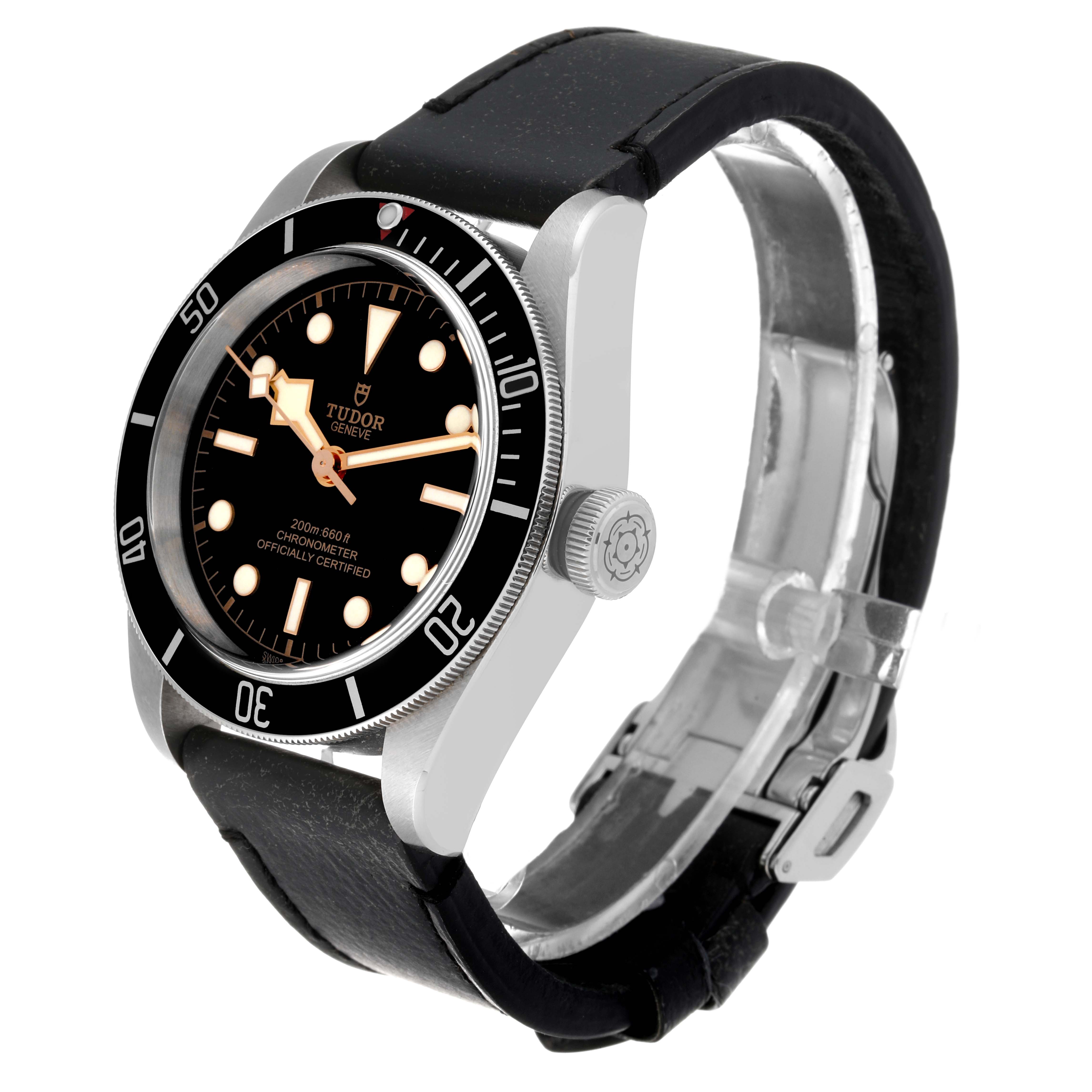 This image shows a Tudor Heritage Black Bay 79230 Men's Stainless Steel Black Dial 79230 Men's Stainless Steel Black Dial watch from a front-right angle, highlighting the face, bezel, crown, and leather strap.