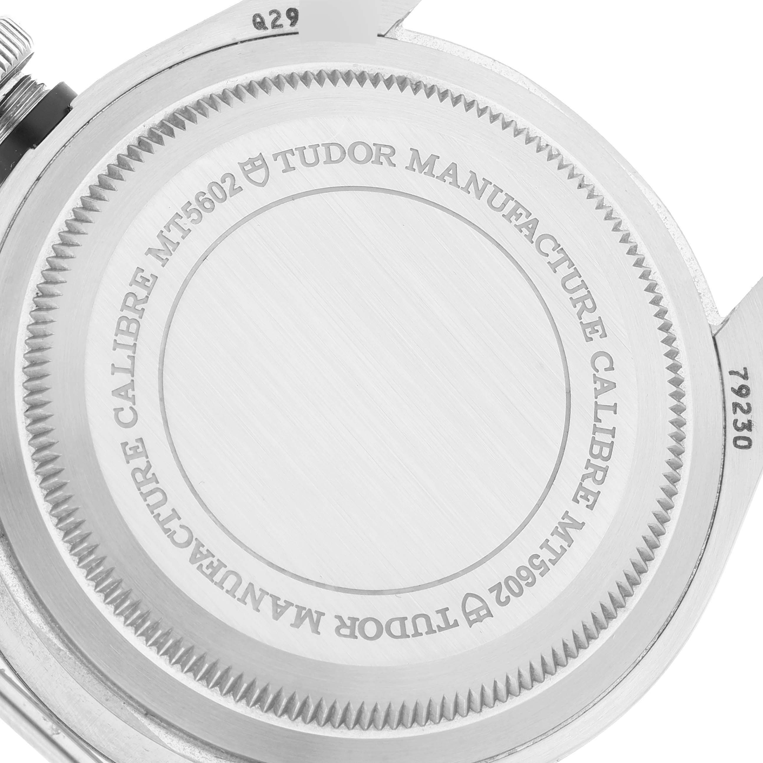 The image shows the back casing and part of the crown of a Tudor Heritage Black Bay 79230 Men's Stainless Steel Black Dial 79230 Men's Stainless Steel Black Dial watch, highlighting the Tudor Manufacture Calibre MT5602.