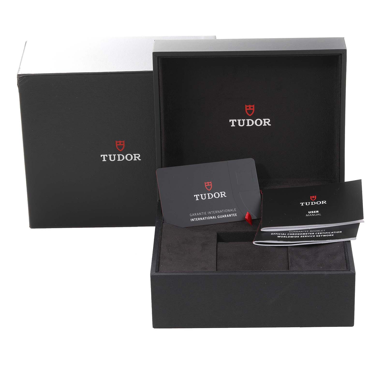 The image shows the Tudor Heritage Black Bay 79363N Men
s Steel and Gold (two tone) Black Dial 79363N Men
s Steel and Gold (two tone) Black Dial box, guarantee card, and user manual from a front angle.