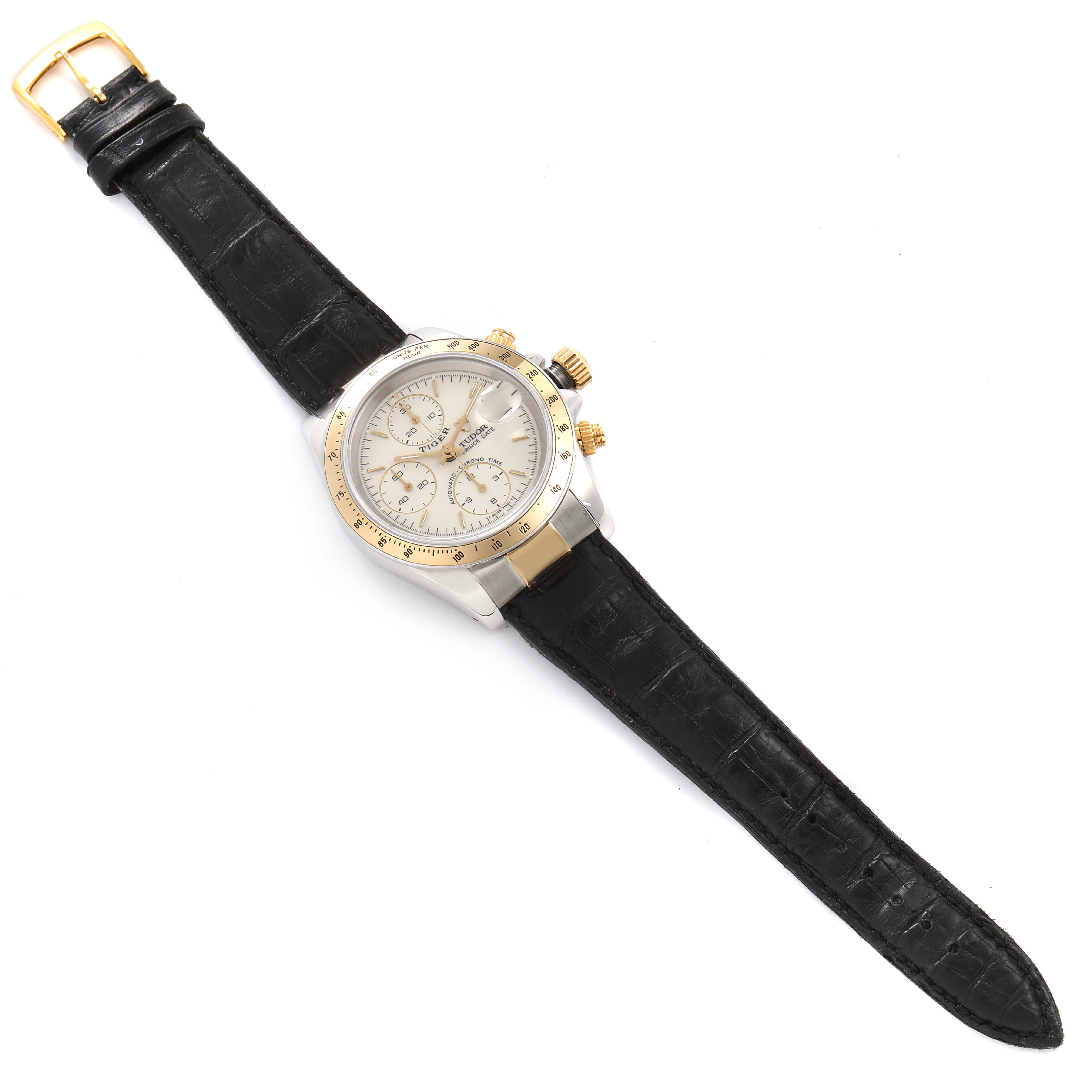 The Tudor Tiger 79263 Men's Steel and Gold (two tone) White Dial 79263 Men's Steel and Gold (two tone) White Dial watch is shown from a top-down angle, highlighting the dial, bezel, and black leather strap.