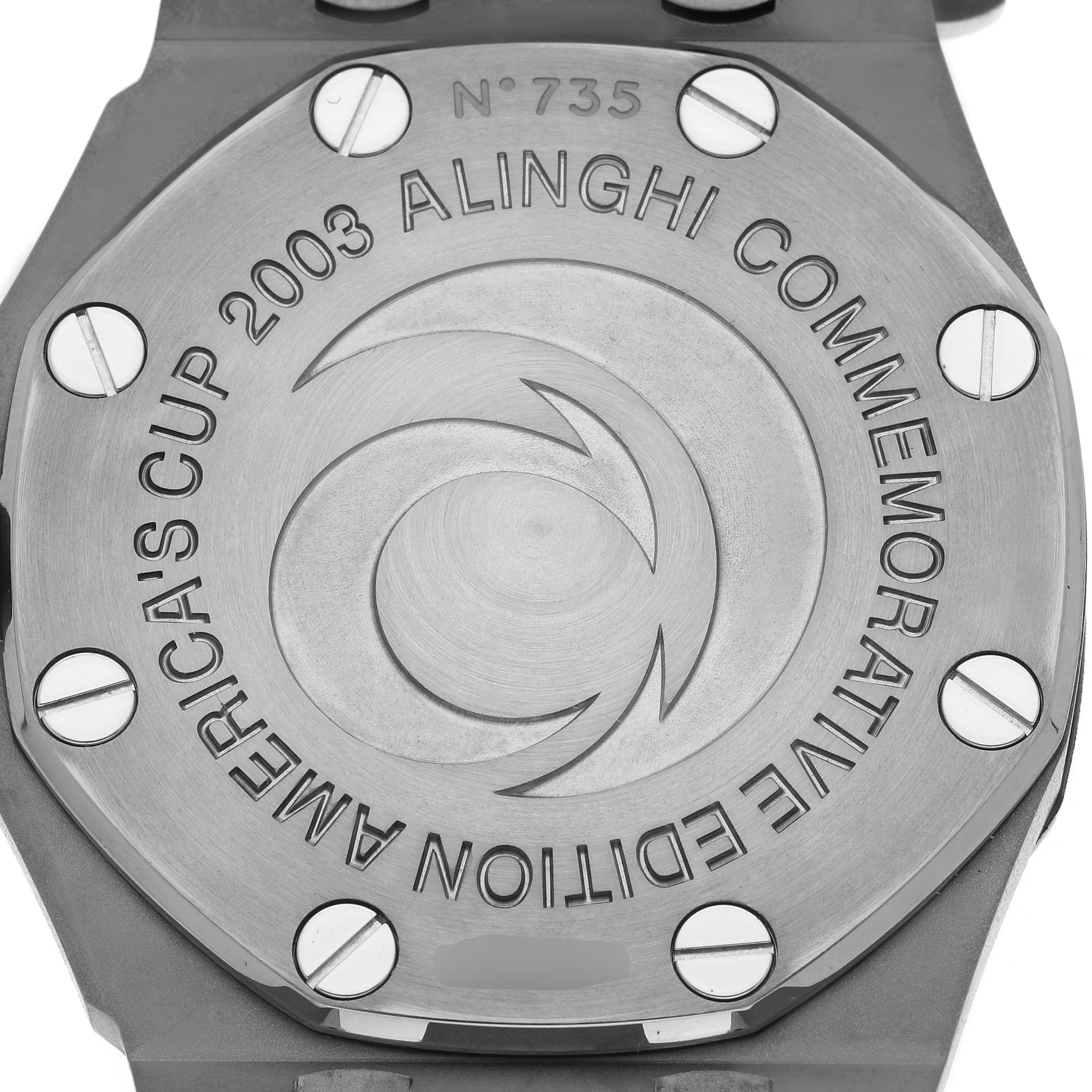 The image shows the case back of an Audemars Piguet Royal Oak 2599IP.OO.1000TI.01 Men
s Titanium Black Dial, featuring engravings for the 2003 America
s Cup Alinghi Commemorative Edition.