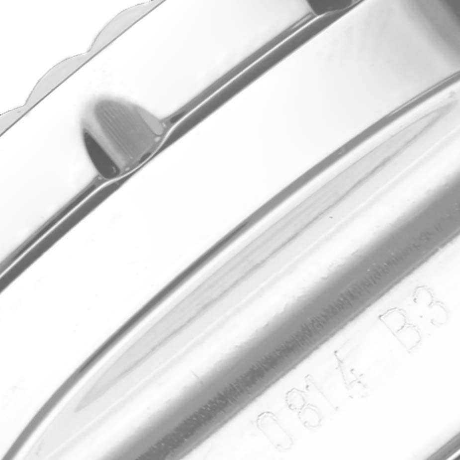 The image shows a close-up of the edge of a Breitling Bentley AB061112/G768-990A Men's Stainless Steel Silver Dial AB061112/G768-990A Men's Stainless Steel Silver Dial model watch with part of the caseback visible.