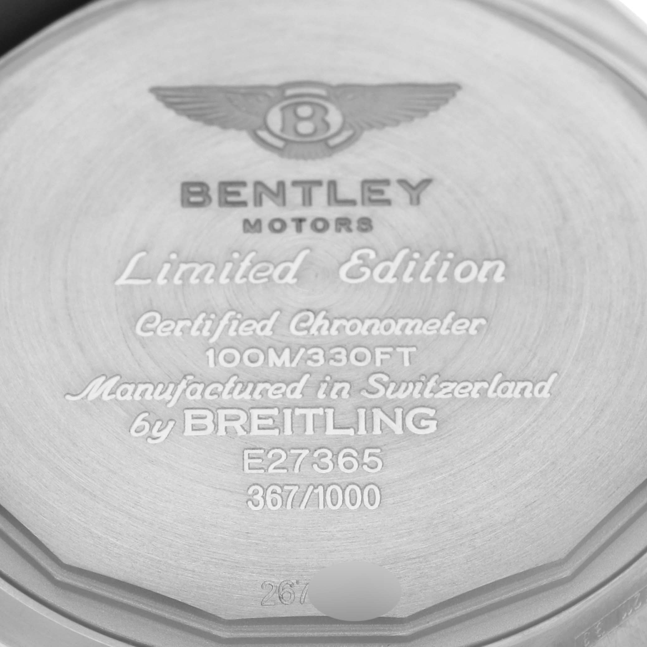 The image shows the engraved back of a Breitling Bentley E27365 Men
s Titanium Black Dial E27365 Men
s Titanium Black Dial watch, highlighting the model number and limited edition status.