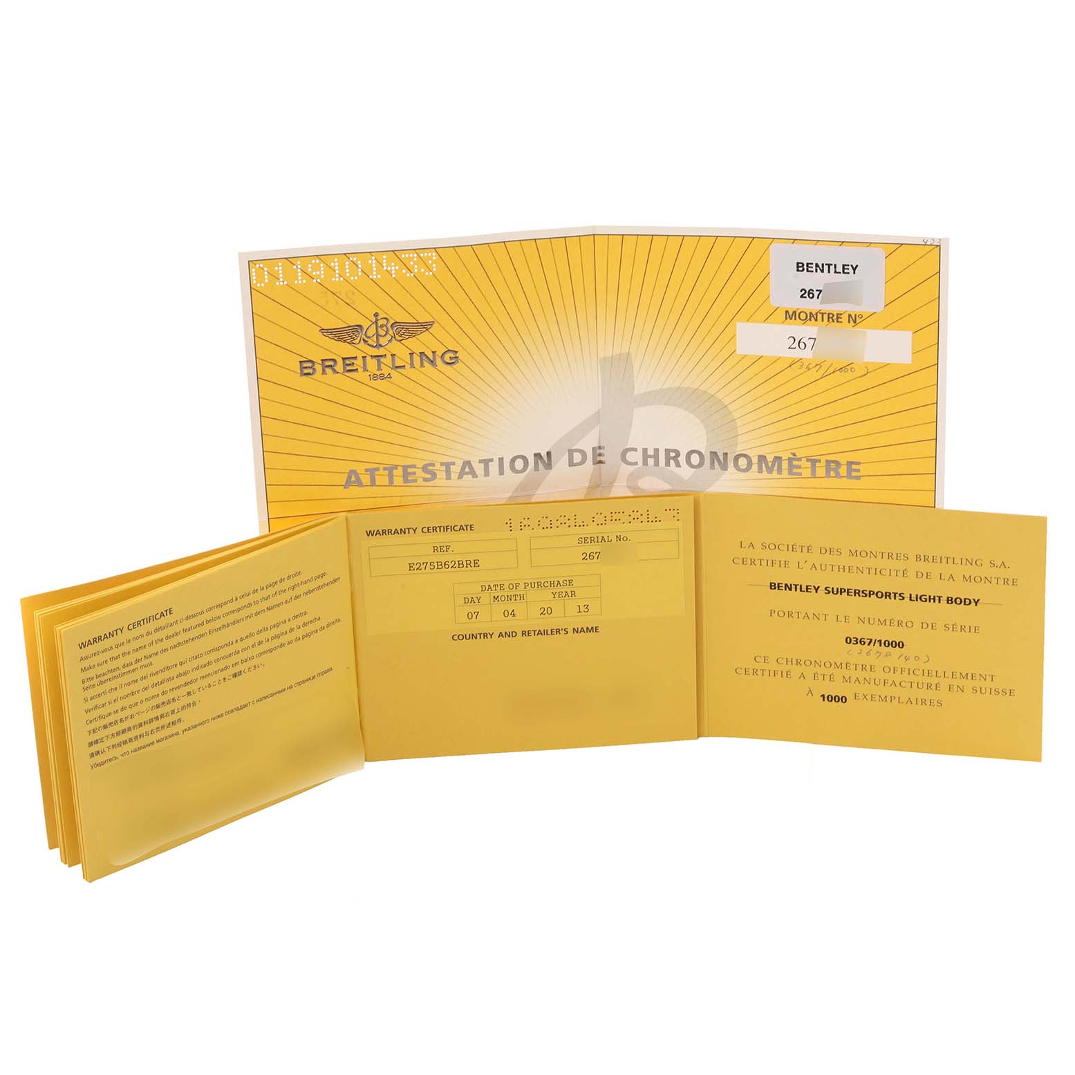 The image shows warranty certificates and a chronometer attestation booklet for a Breitling Bentley E27365 Men
s Titanium Black Dial E27365 Men
s Titanium Black Dial watch model.