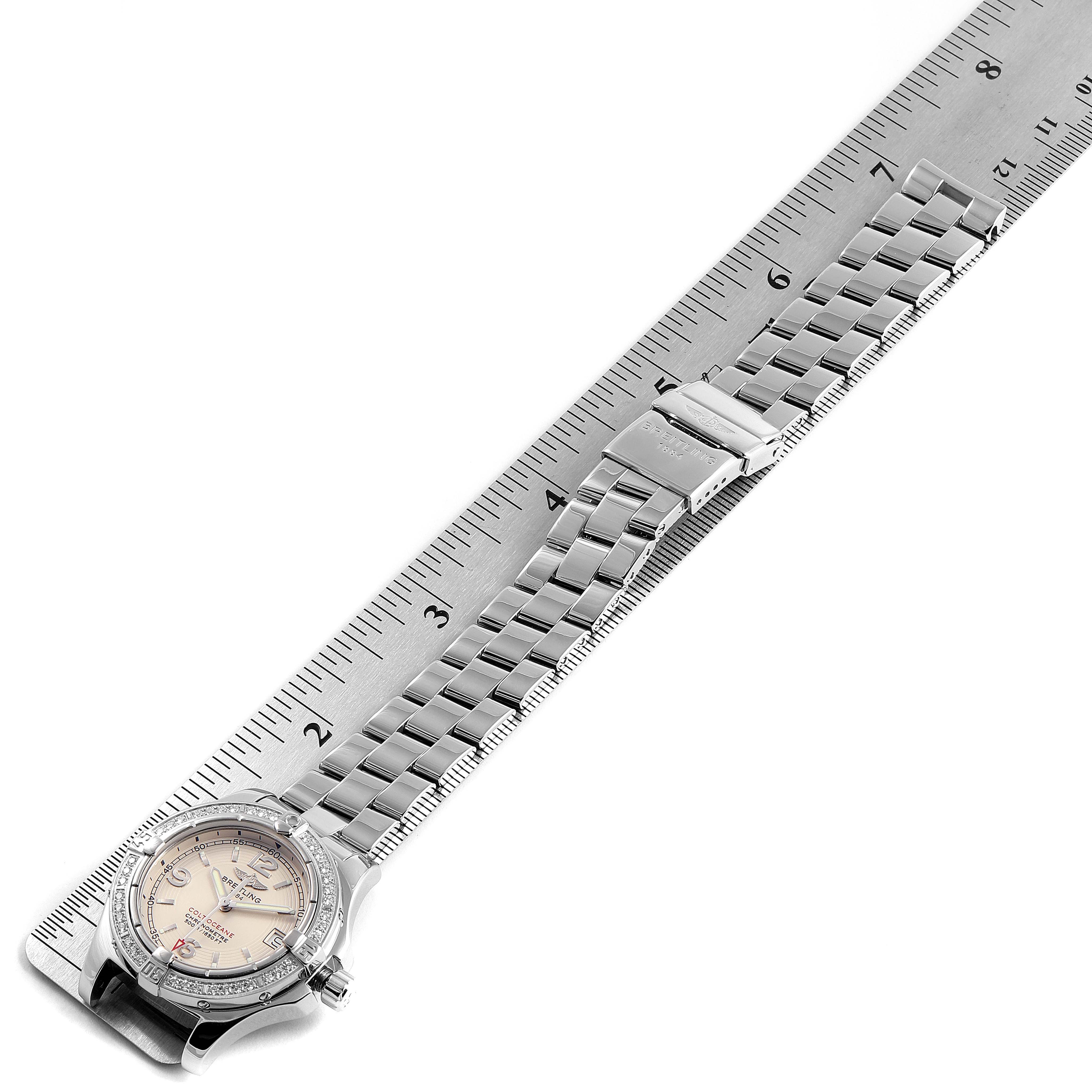 The image shows the front view of a Breitling A77380 Women
s Stainless Steel Silver Dial A77380 Women
s Stainless Steel Silver Dial Colt Oceane Stainless Steel Diamond Ladies Watch A77380, alongside a measuring ruler.