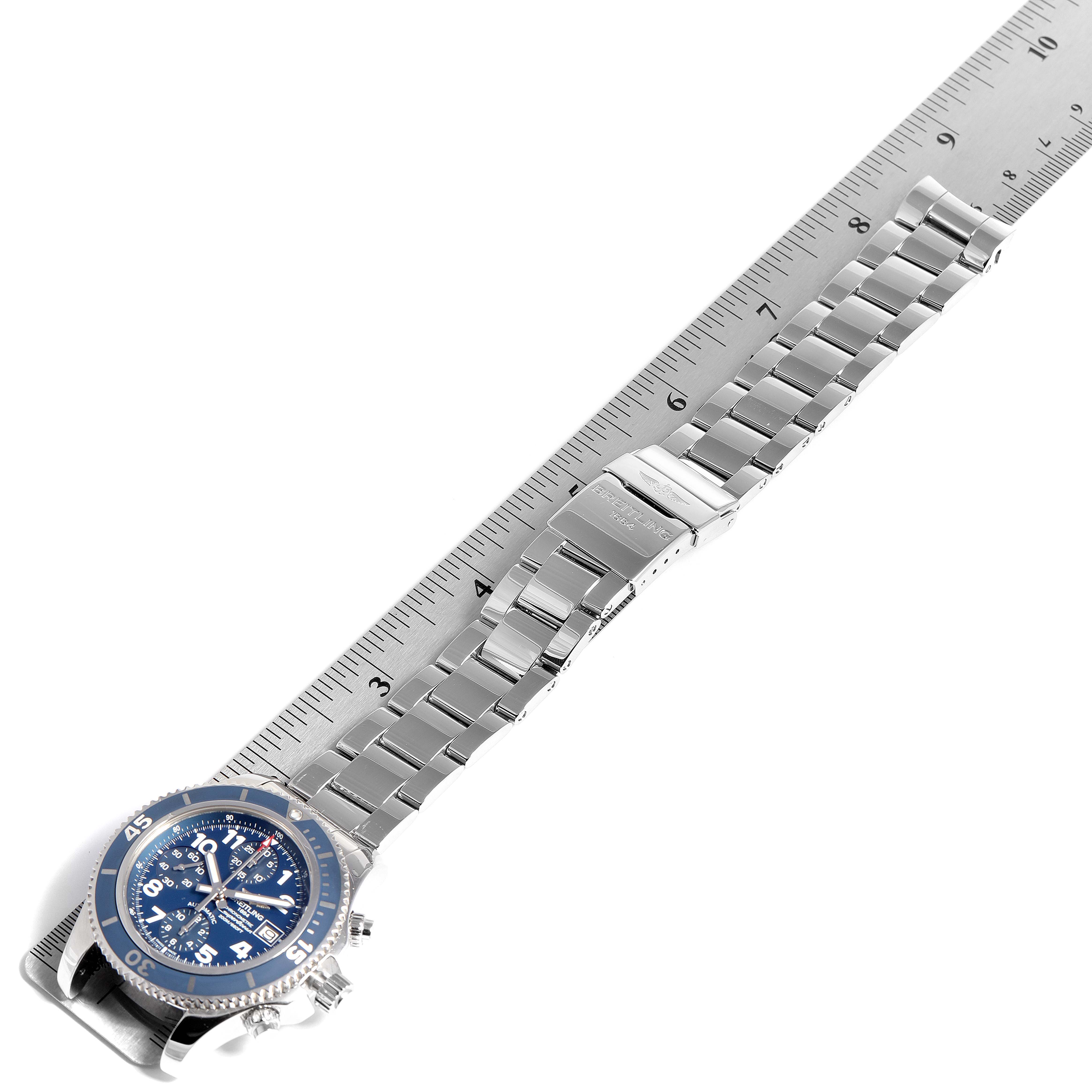 The Breitling Superocean A13311 Men's Stainless Steel Blue Dial A13311 Men's Stainless Steel Blue Dial watch is shown at a slight angle, displaying its full metal bracelet and clasp alongside a measurement ruler.