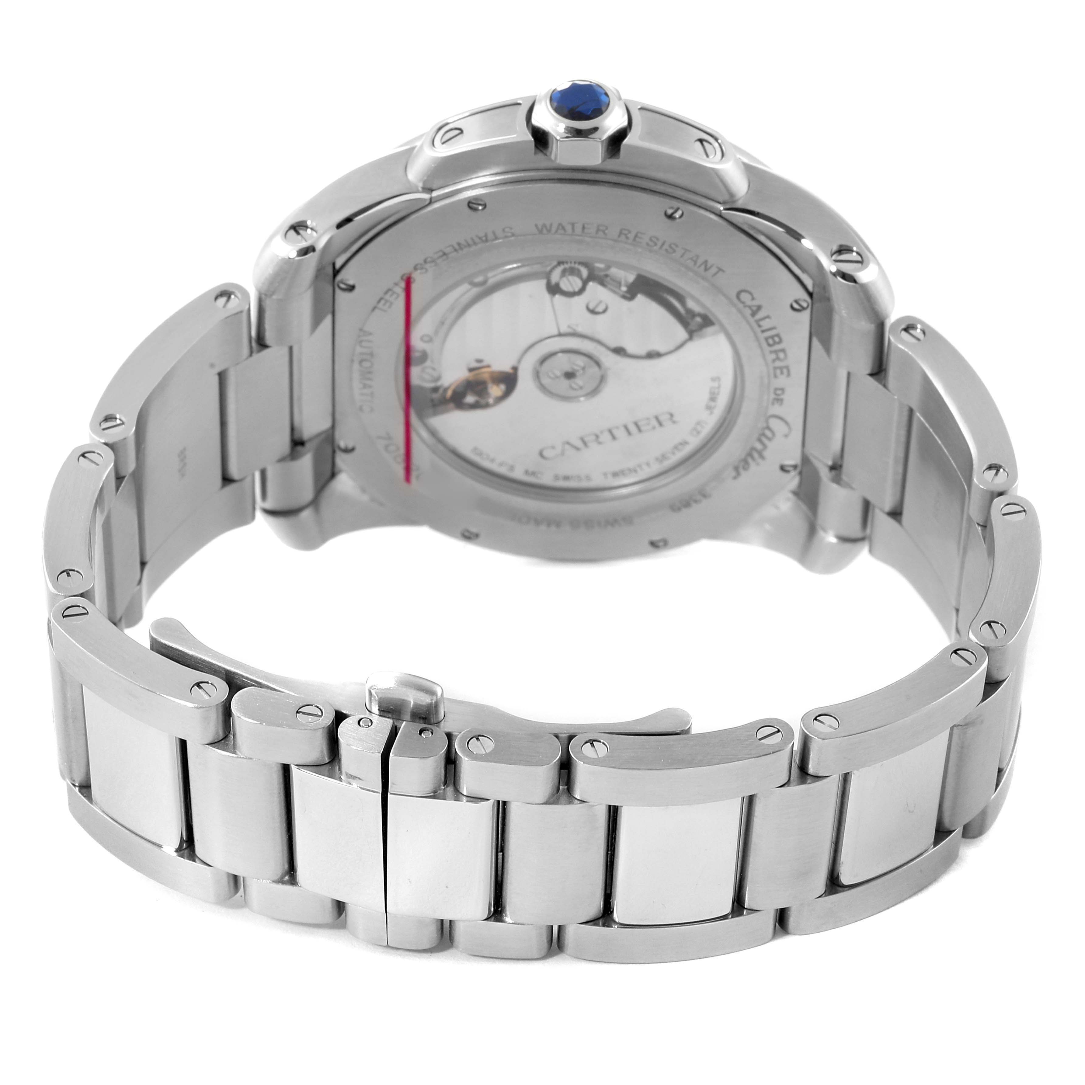 The image shows the back view and bracelet of a Calibre de Cartier watch by Cartier, highlighting its transparent case back.