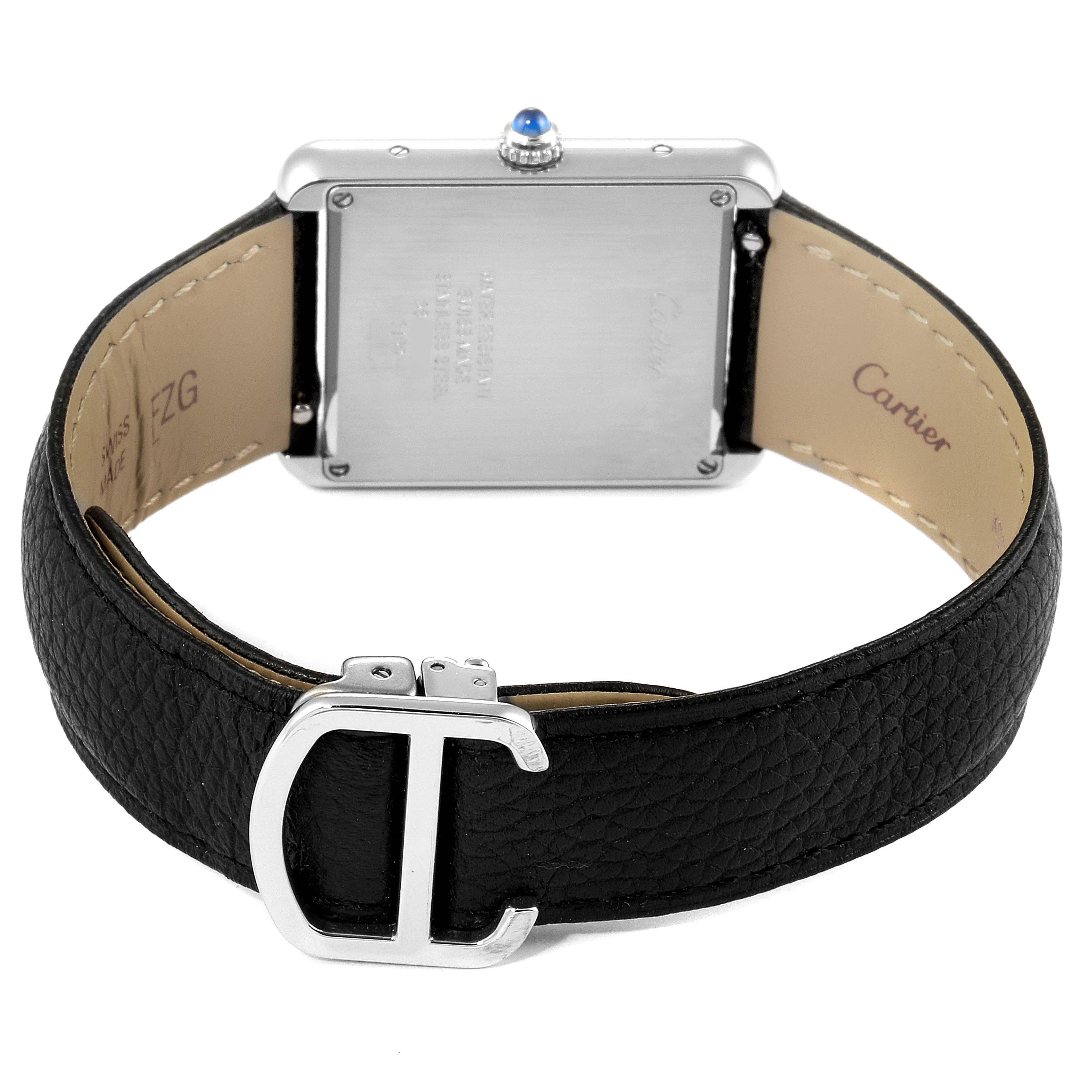 The image shows the back of the Tank Solo watch by Cartier, including its leather strap and metal clasp.