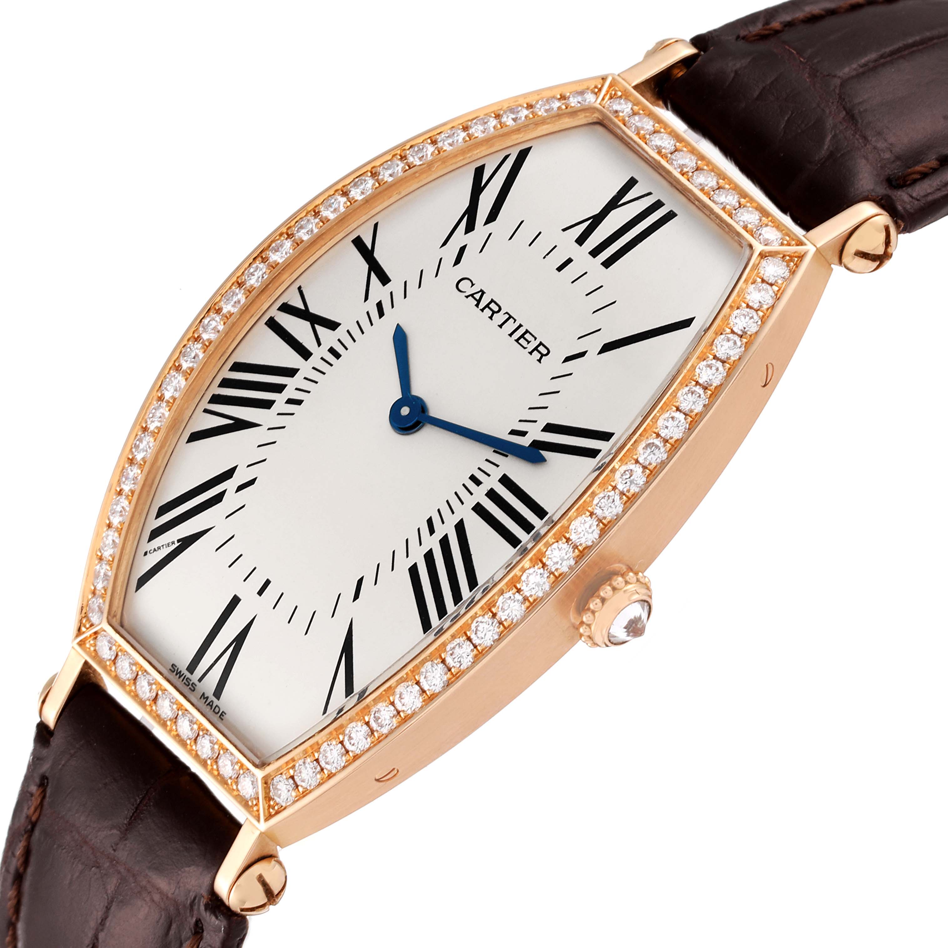 This image shows a Cartier Tonneau 2849 Women's Rose Gold Silver Dial 2849 Women's Rose Gold Silver Dial watch at an angle, highlighting the brown leather strap, diamond-encrusted bezel, dial, and crown.