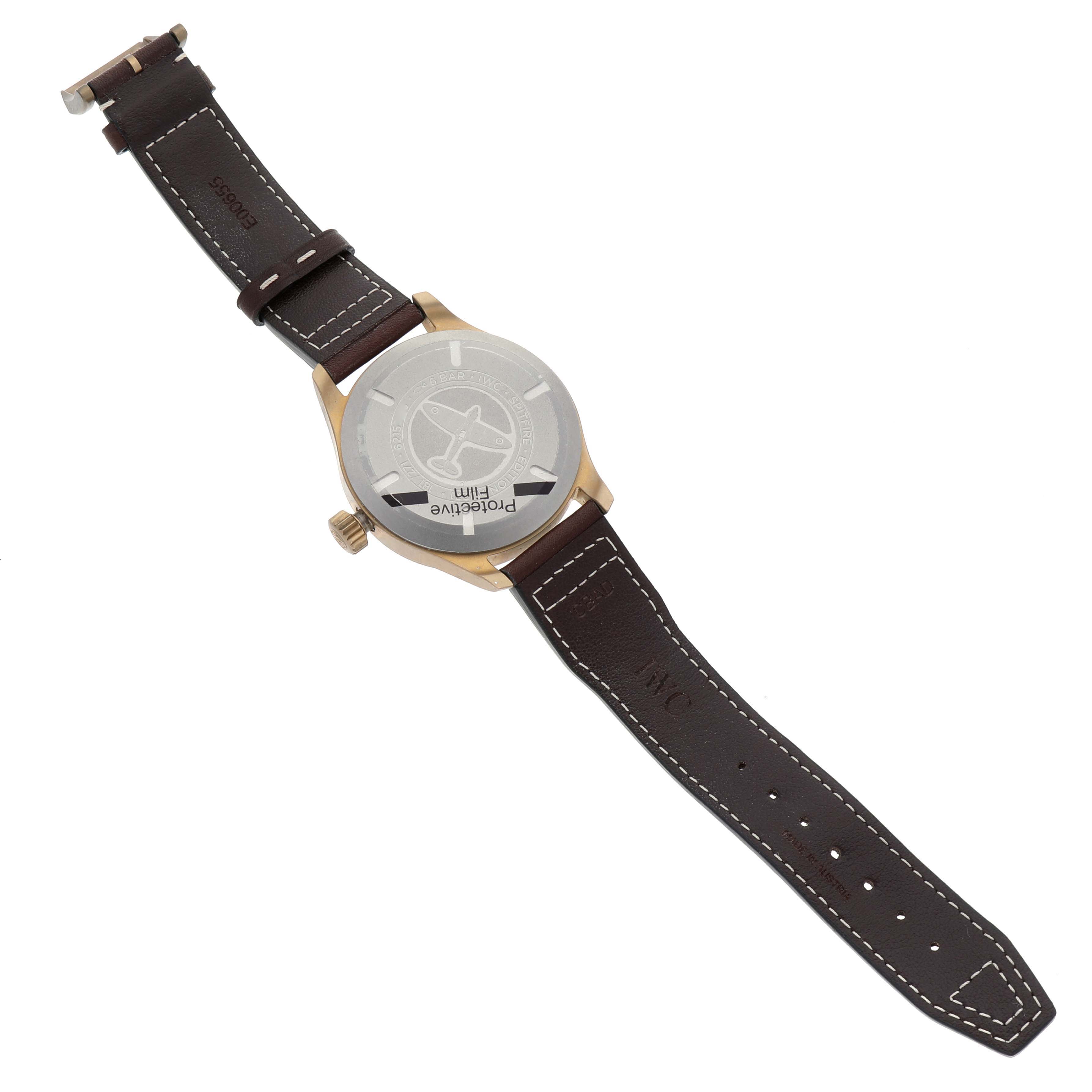 This IWC Pilot IW327101 Men's Bronze Green Dial IW327101 Men's Bronze Green Dial watch is shown from the back, displaying its case back and brown leather strap.