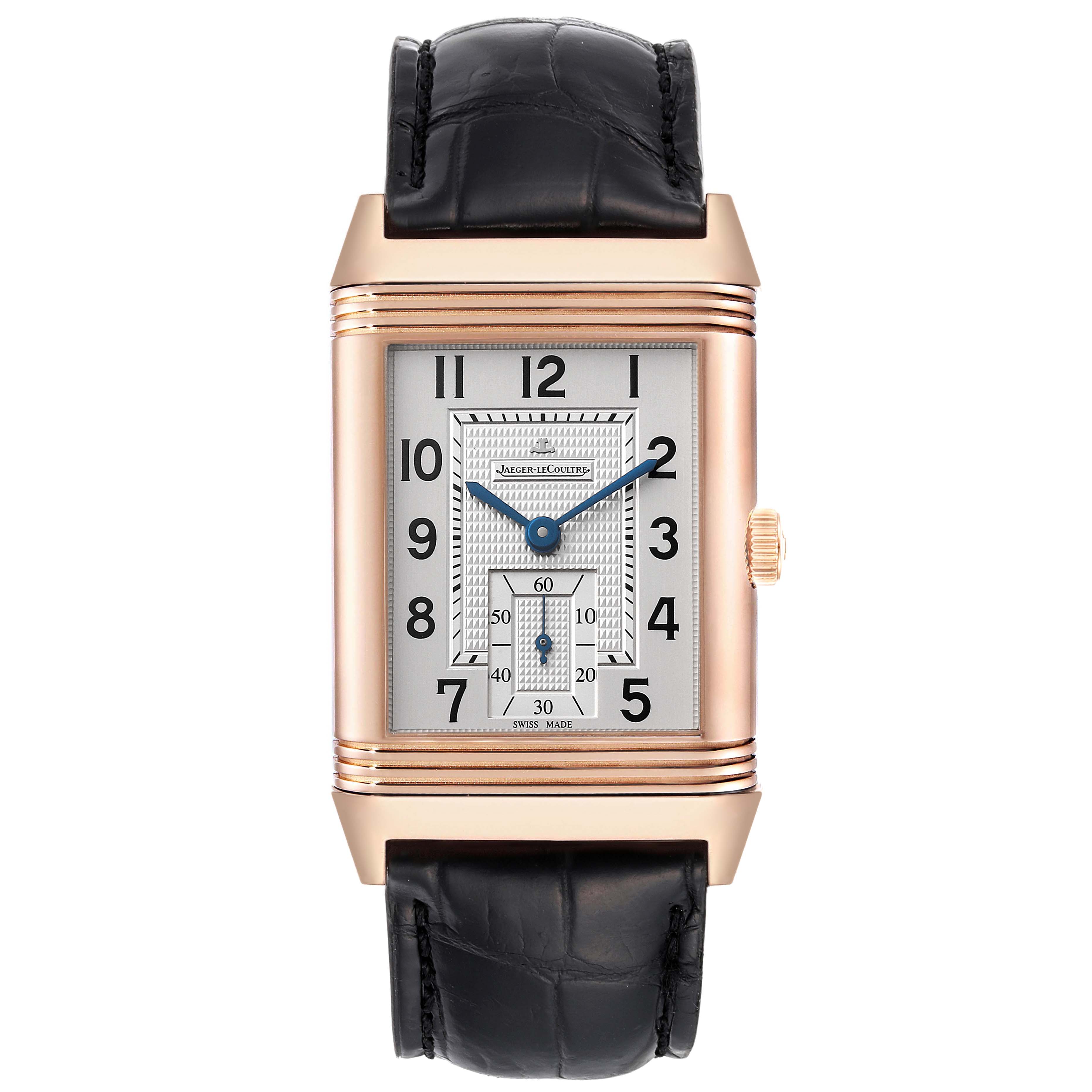 The image shows a Jaeger-LeCoultre Reverso watch from the front, highlighting the dial, numerals, hands, crown, and leather strap.