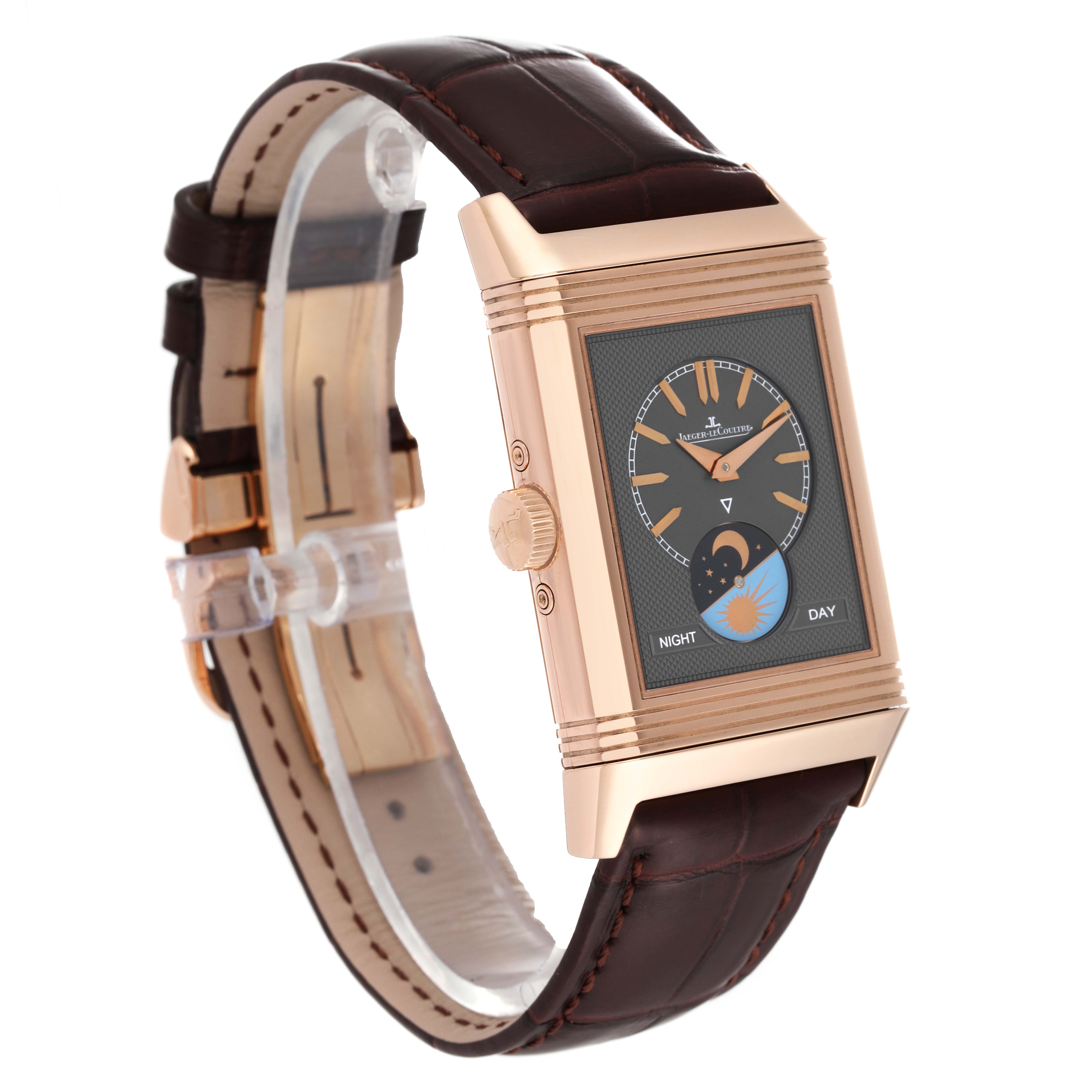 The image shows a Jaeger LeCoultre Reverso Q3912420 Men
s Rose Gold Silver Dial Q3912420 Men
s Rose Gold Silver Dial watch from a side angle, highlighting its rectangular dial and brown leather strap.