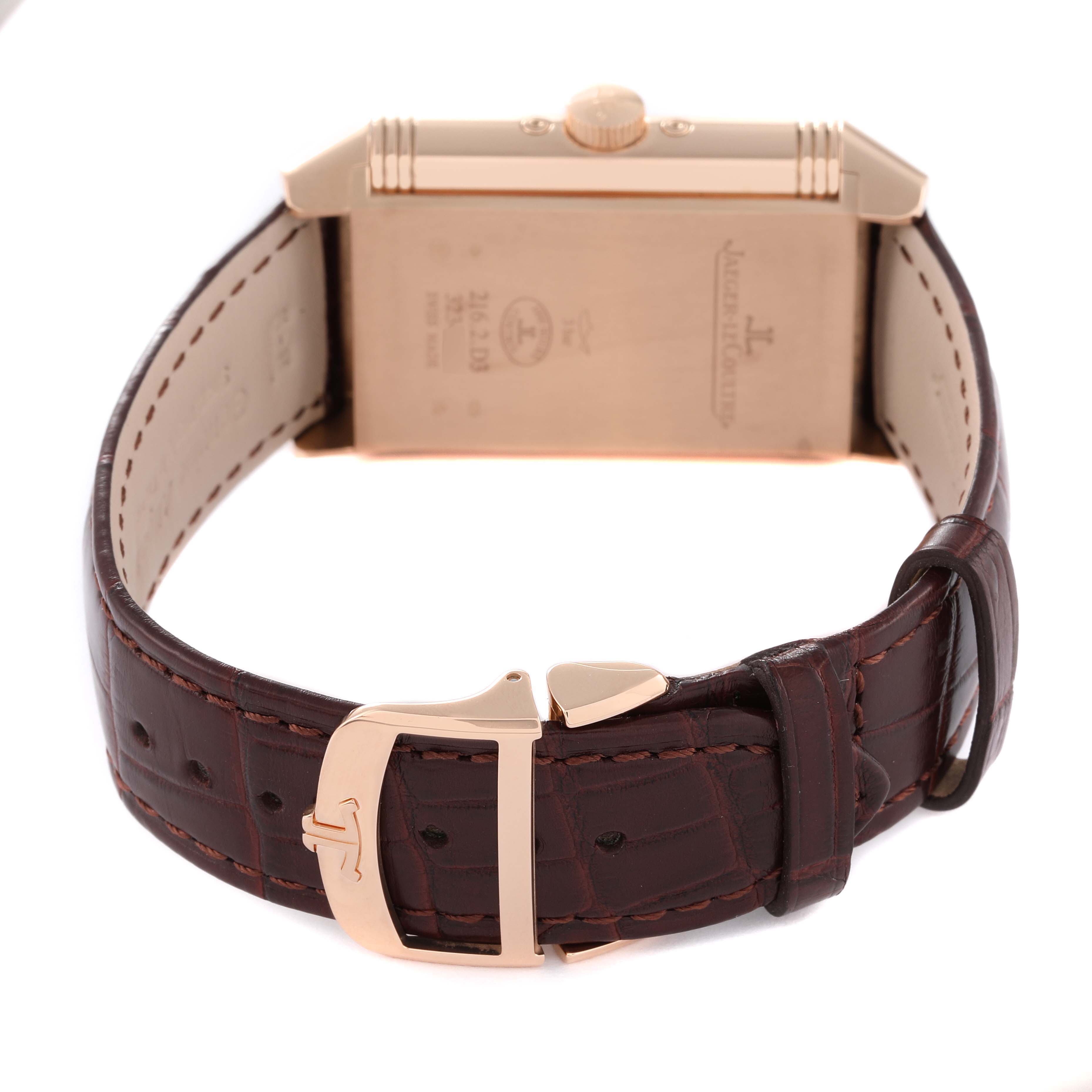 This image shows the back and brown leather strap of a Jaeger LeCoultre Reverso Q3912420 Men
s Rose Gold Silver Dial Q3912420 Men
s Rose Gold Silver Dial watch, angled to highlight the buckle and case back.