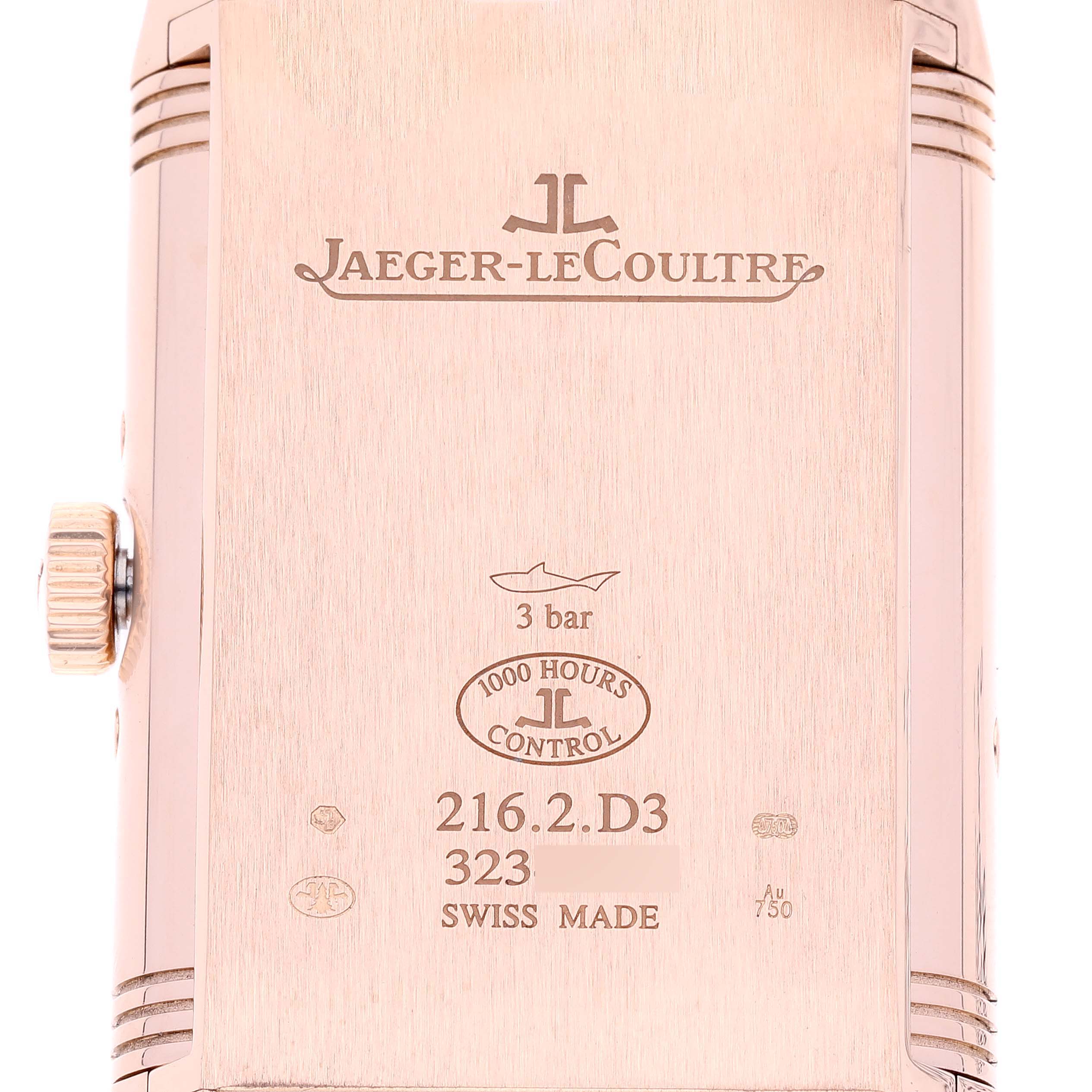 This image shows the back case of a Jaeger-LeCoultre Reverso watch in a close-up view, highlighting the engravings and crown.