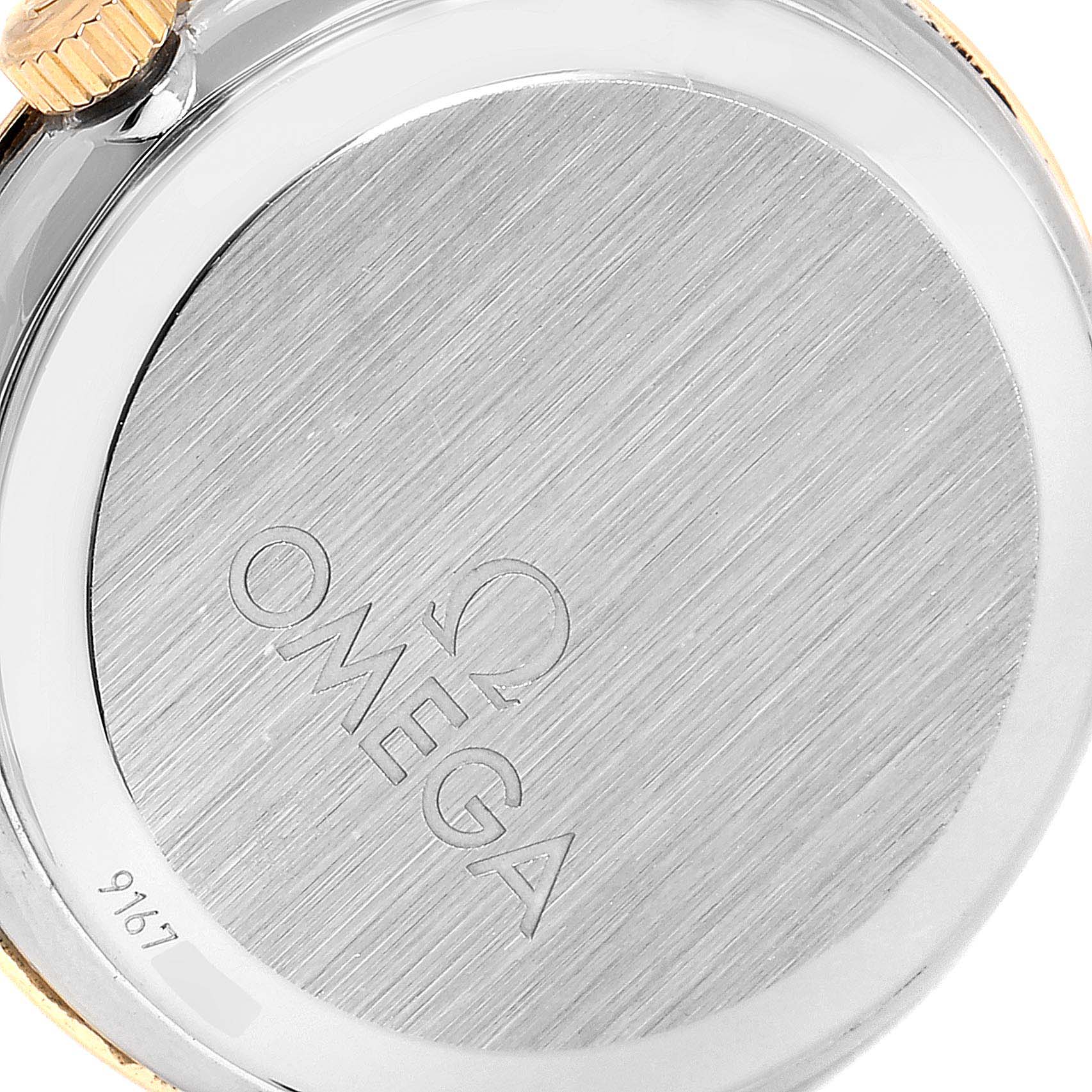 The image shows the back case and crown of the Omega 413.25.27.60.05.001 Women
s Steel and Gold (two tone) Mother of Pearl Dial 413.25.27.60.05.001 Women
s Steel and Gold (two tone) Mother of Pearl Dial DeVille Prestige Steel Yellow Gold Diamond Watch 413.25.27.60.05.001.