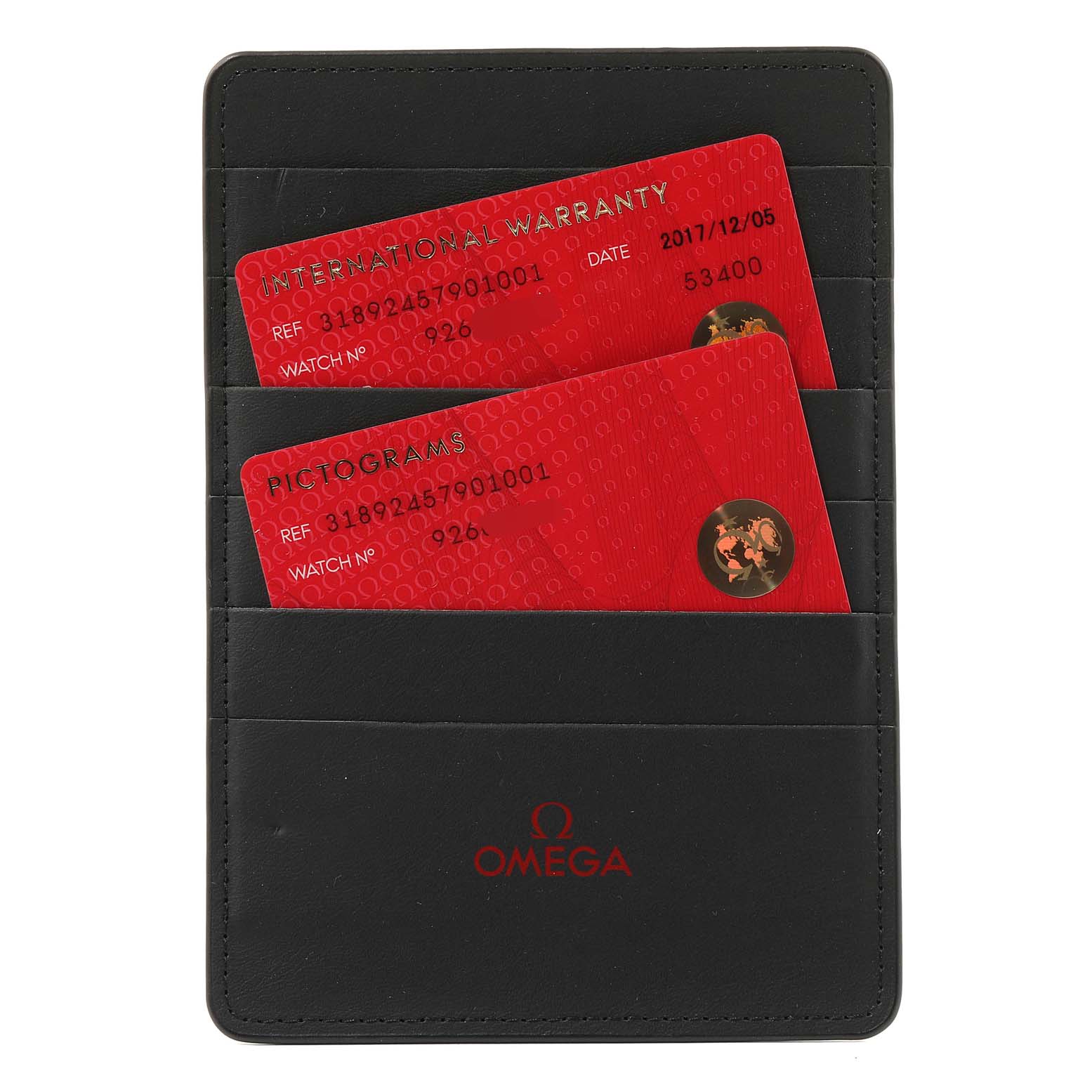 This image shows the International Warranty and Pictograms cards for an Omega Speedmaster 318.92.45.79.01.001 Men's Titanium Black Dial 318.92.45.79.01.001 Men's Titanium Black Dial watch, housed in a black Omega cardholder.