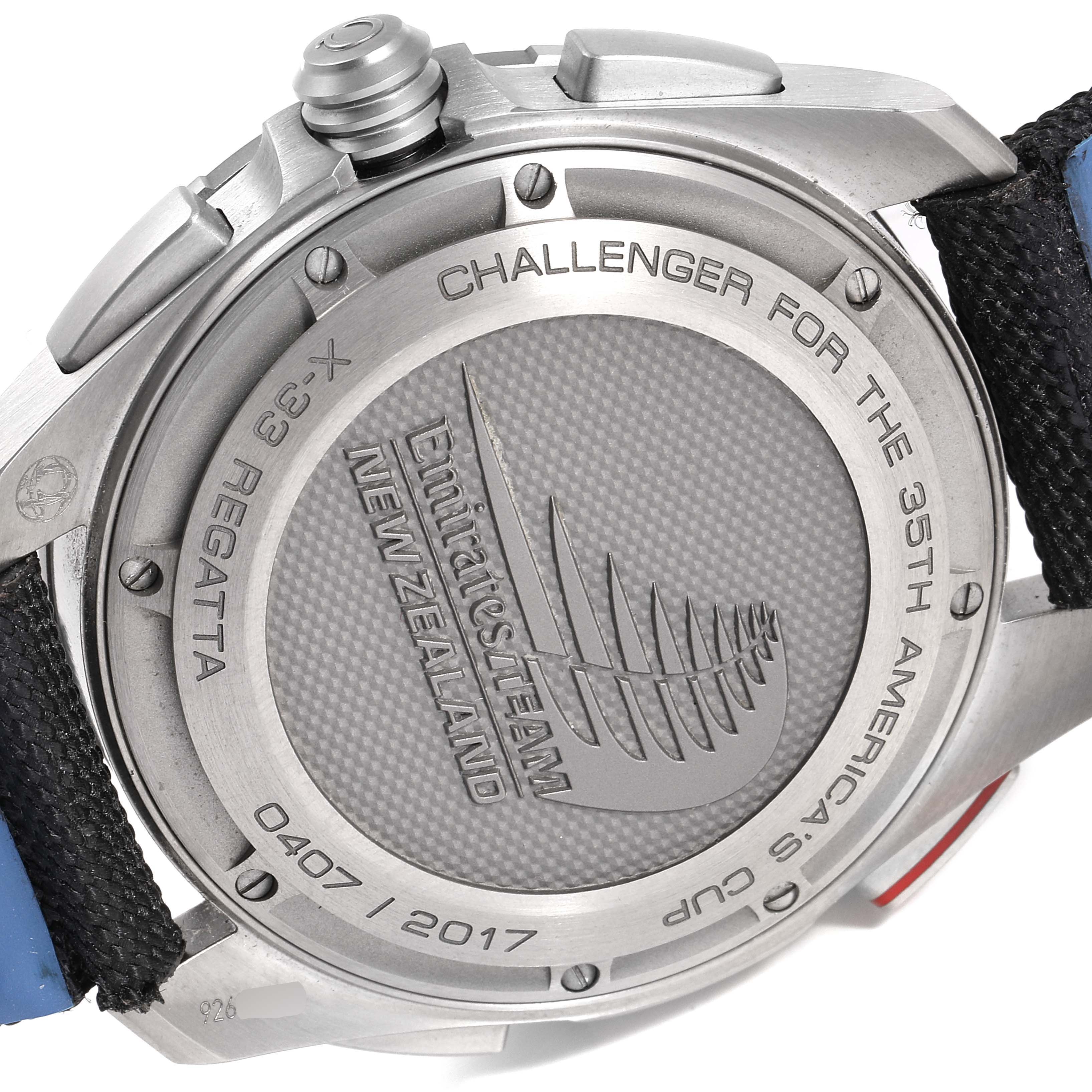 This image shows the case back of an Omega Speedmaster 318.92.45.79.01.001 Men's Titanium Black Dial 318.92.45.79.01.001 Men's Titanium Black Dial X-33 Regatta watch, highlighting the engraved text and logos.