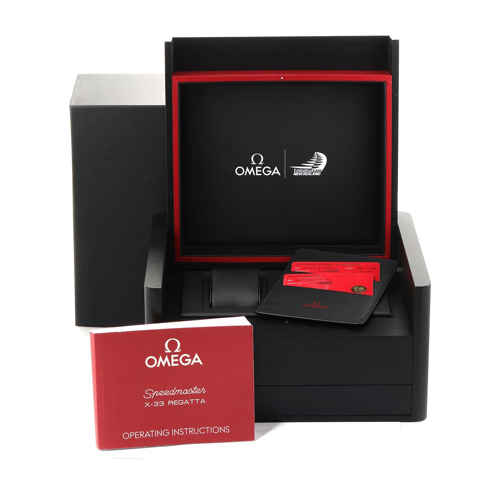 The image shows the packaging of an Omega Speedmaster 318.92.45.79.01.001 Men's Titanium Black Dial 318.92.45.79.01.001 Men's Titanium Black Dial watch, including a box, operating instructions, and warranty cards.