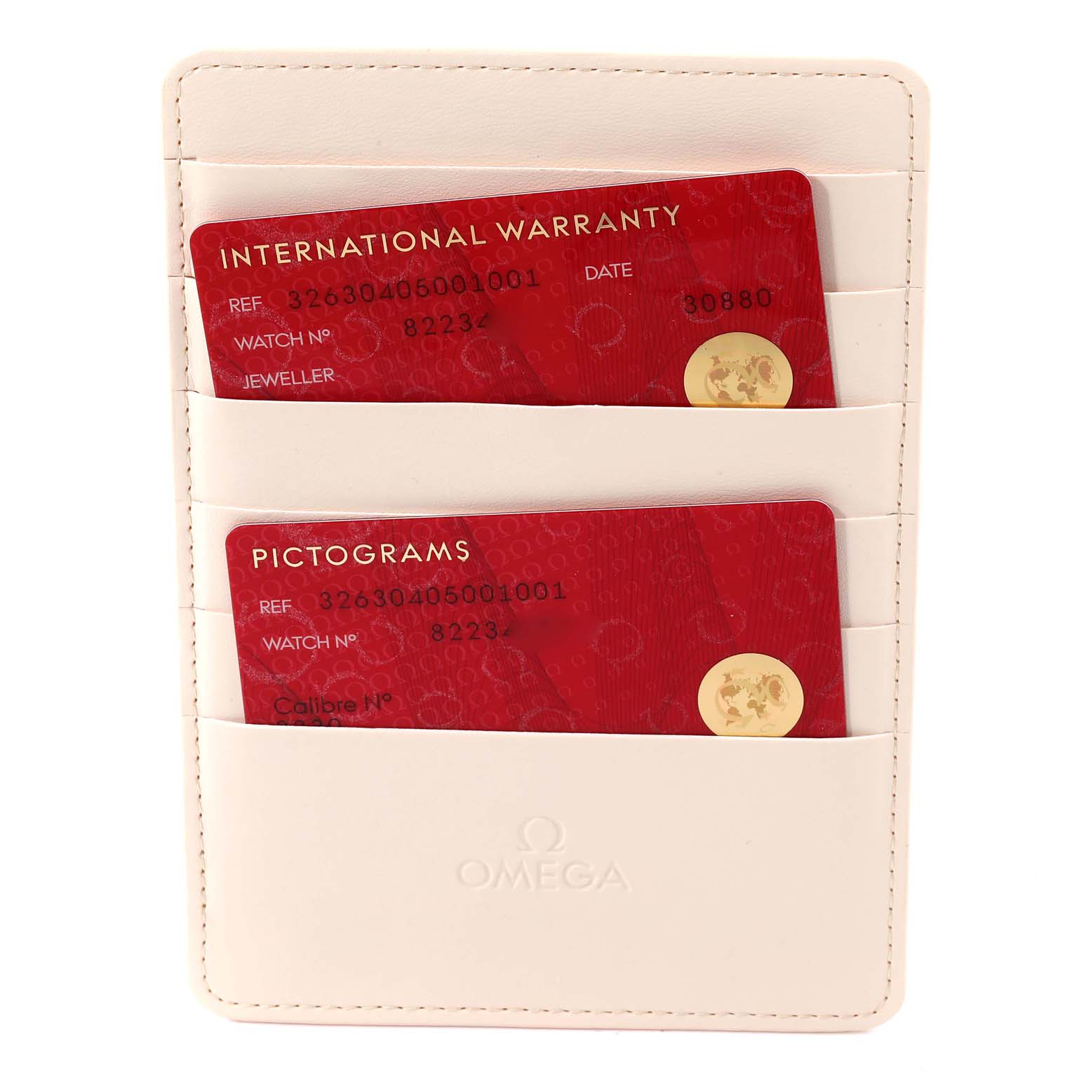 This image shows the Omega Speedmaster 326.30.40.50.01.001 Men's Stainless Steel Black Dial 326.30.40.50.01.001 Men's Stainless Steel Black Dial's warranty and pictograms cards in a beige cardholder.