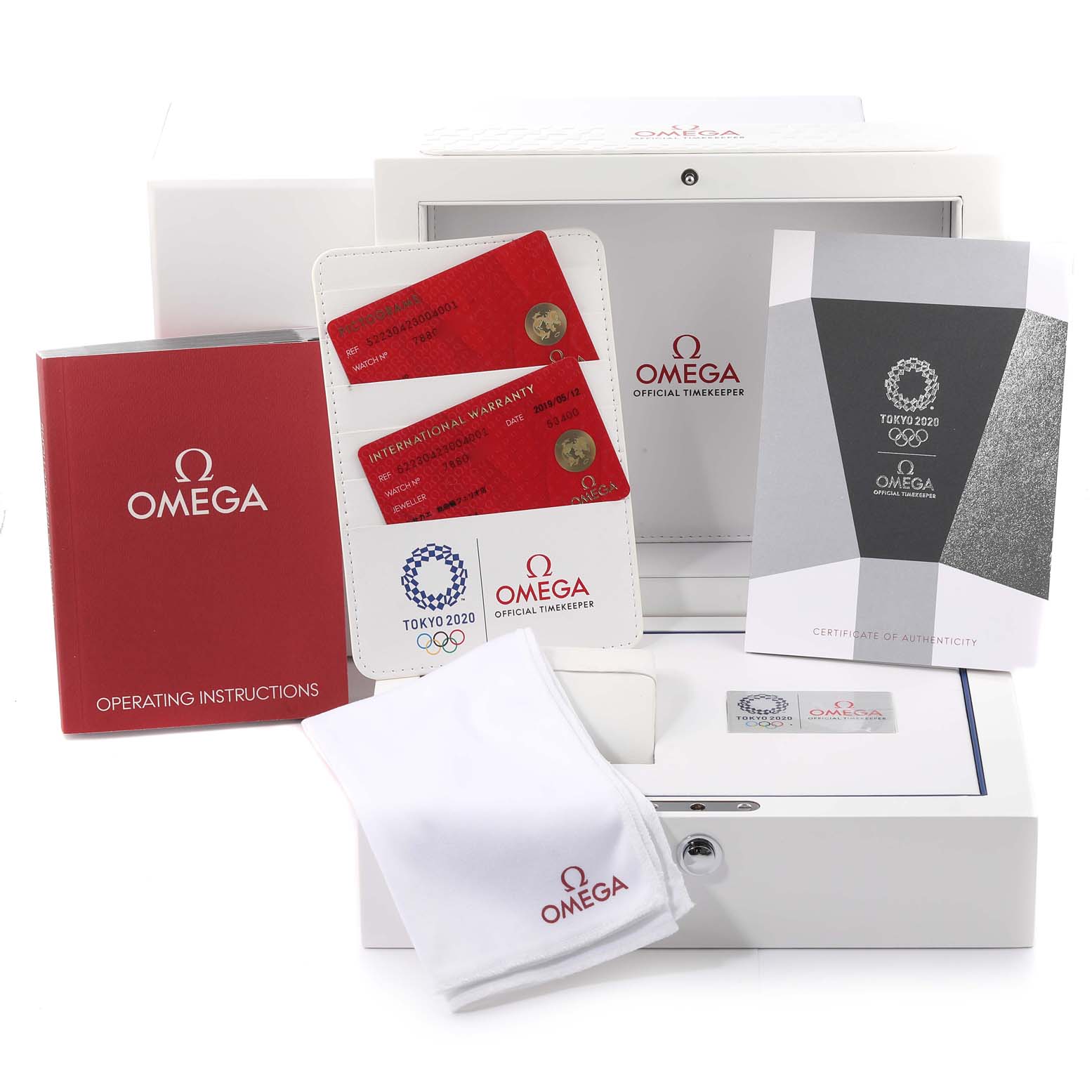 This image shows the packaging, booklets, and warranty cards for the Omega Speedmaster 522.30.42.30.04.001 Men's Stainless Steel White Dial 522.30.42.30.04.001 Men's Stainless Steel White Dial watch.
