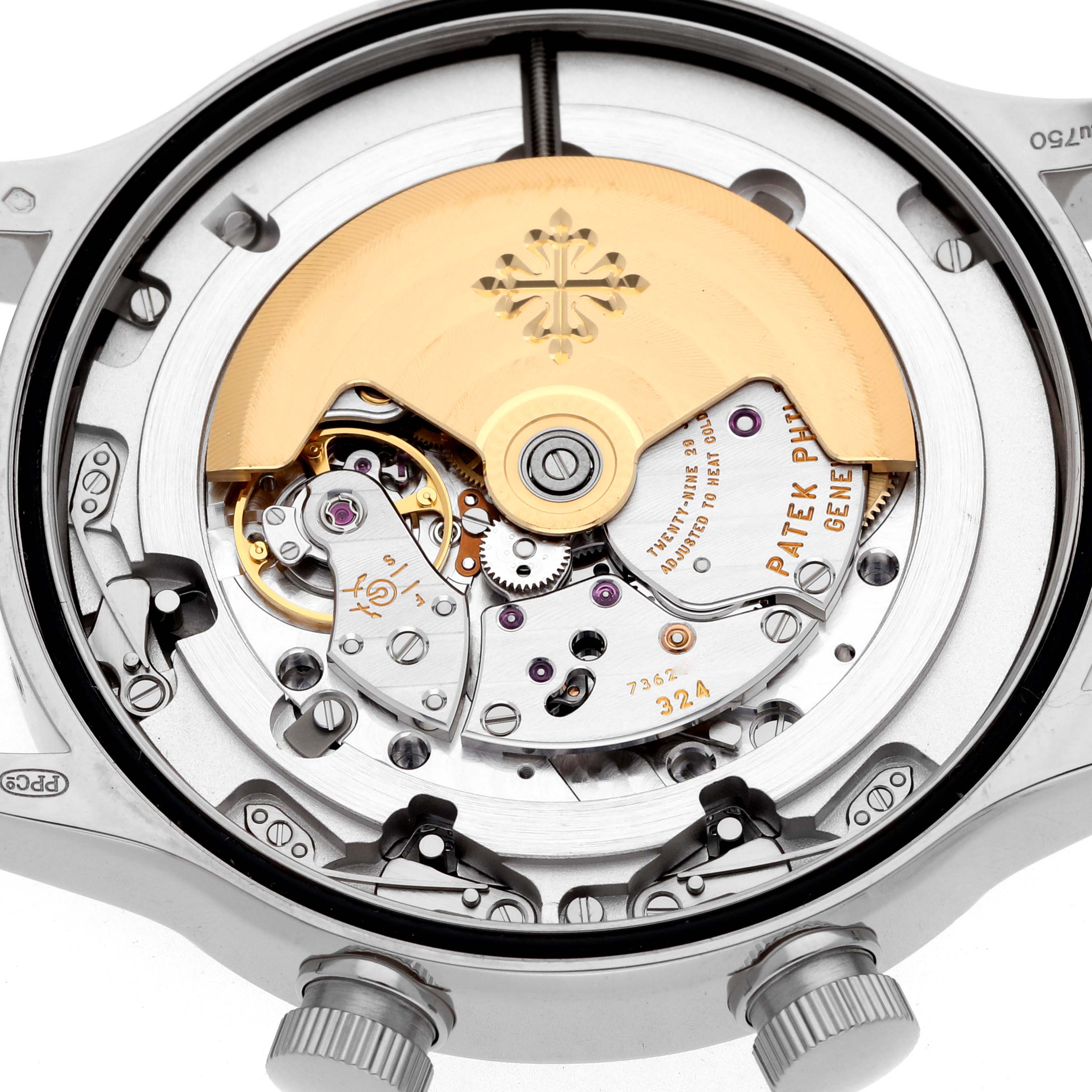 The image displays the movement of a Patek Philippe Calatrava 5524G Men's White Gold Blue Dial, showing gears, coils, and the gold rotor from a rear angle.