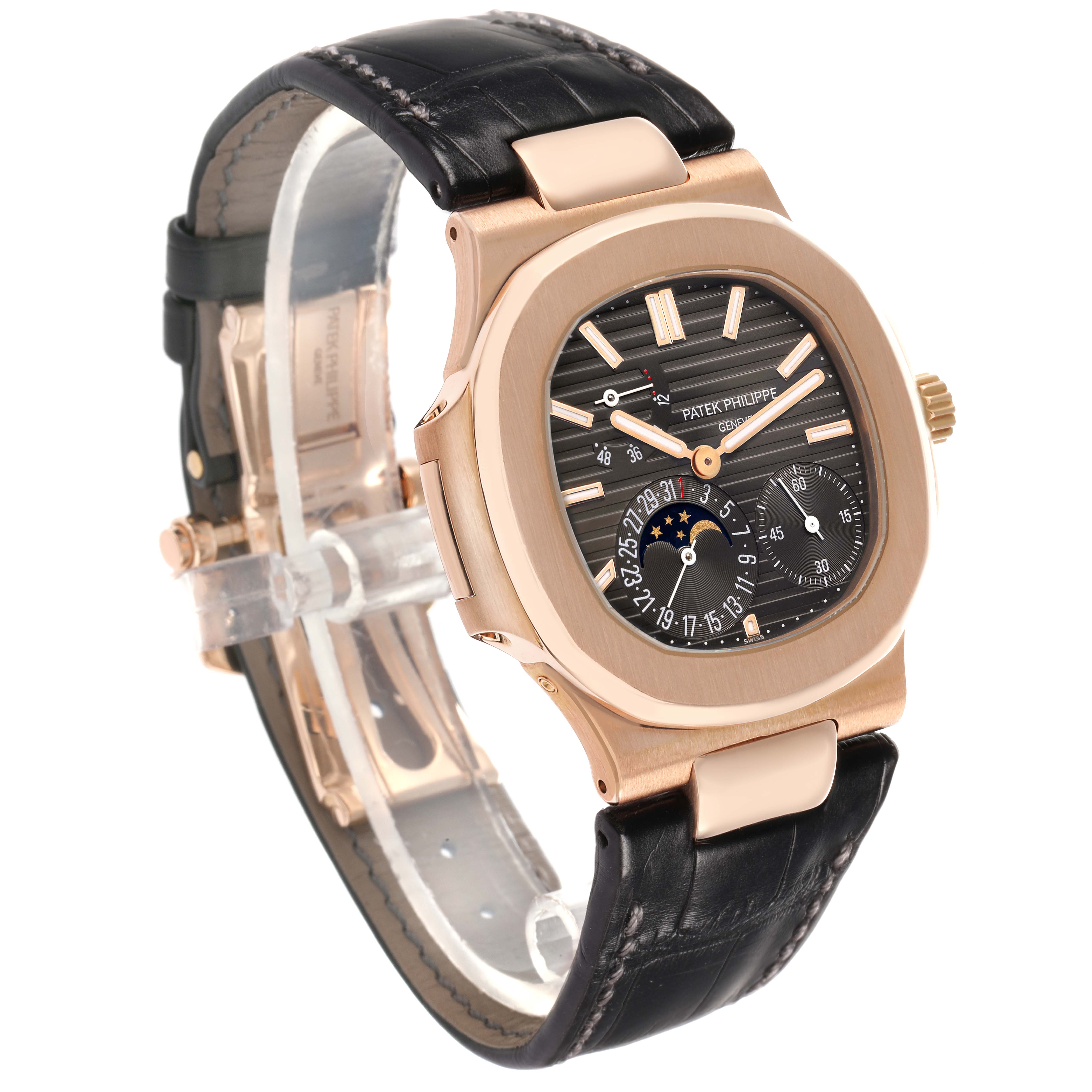 The Patek Philippe Nautilus 5712R-001 Men's Rose Gold Brown Dial watch is shown at a three-quarter angle, displaying the dial, case, and leather strap.