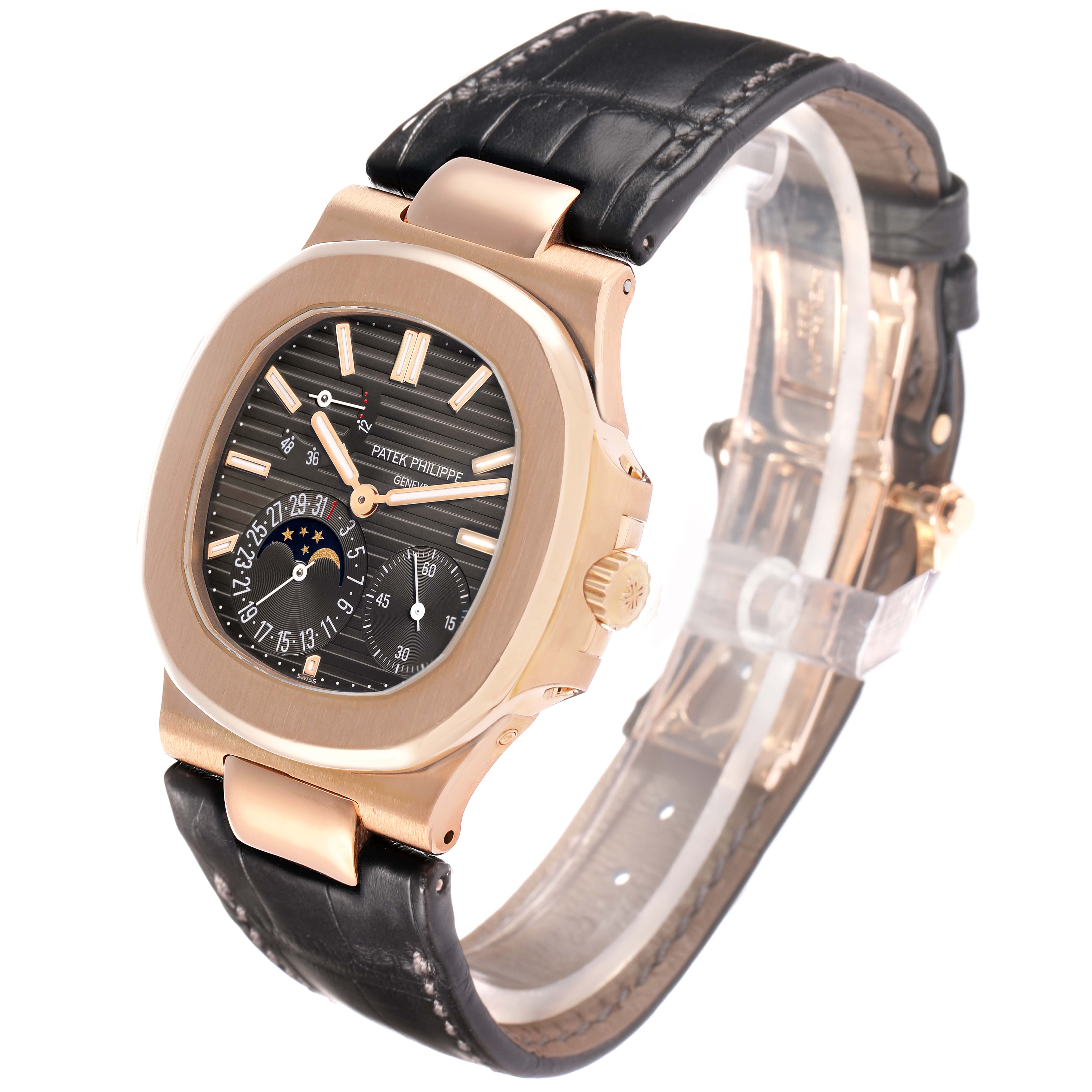 The Patek Philippe Nautilus 5712R-001 Men's Rose Gold Brown Dial watch is shown at a three-quarter angle, highlighting the face, bezel, crown, and black leather strap.