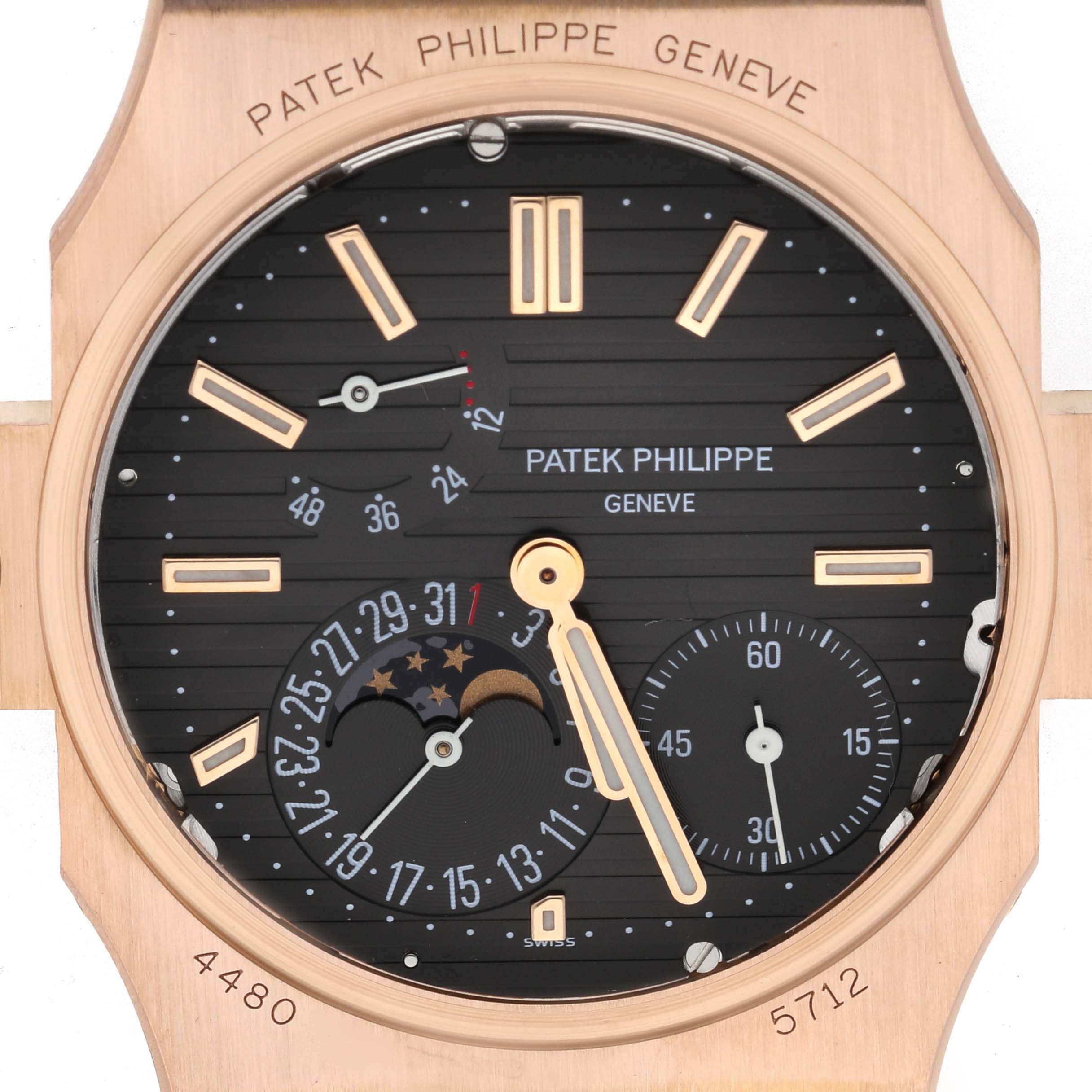 The image shows a close-up of the Patek Philippe Nautilus 5712R-001 Men's Rose Gold Brown Dial watch dial, highlighting its moon phase, subdials, and indices.