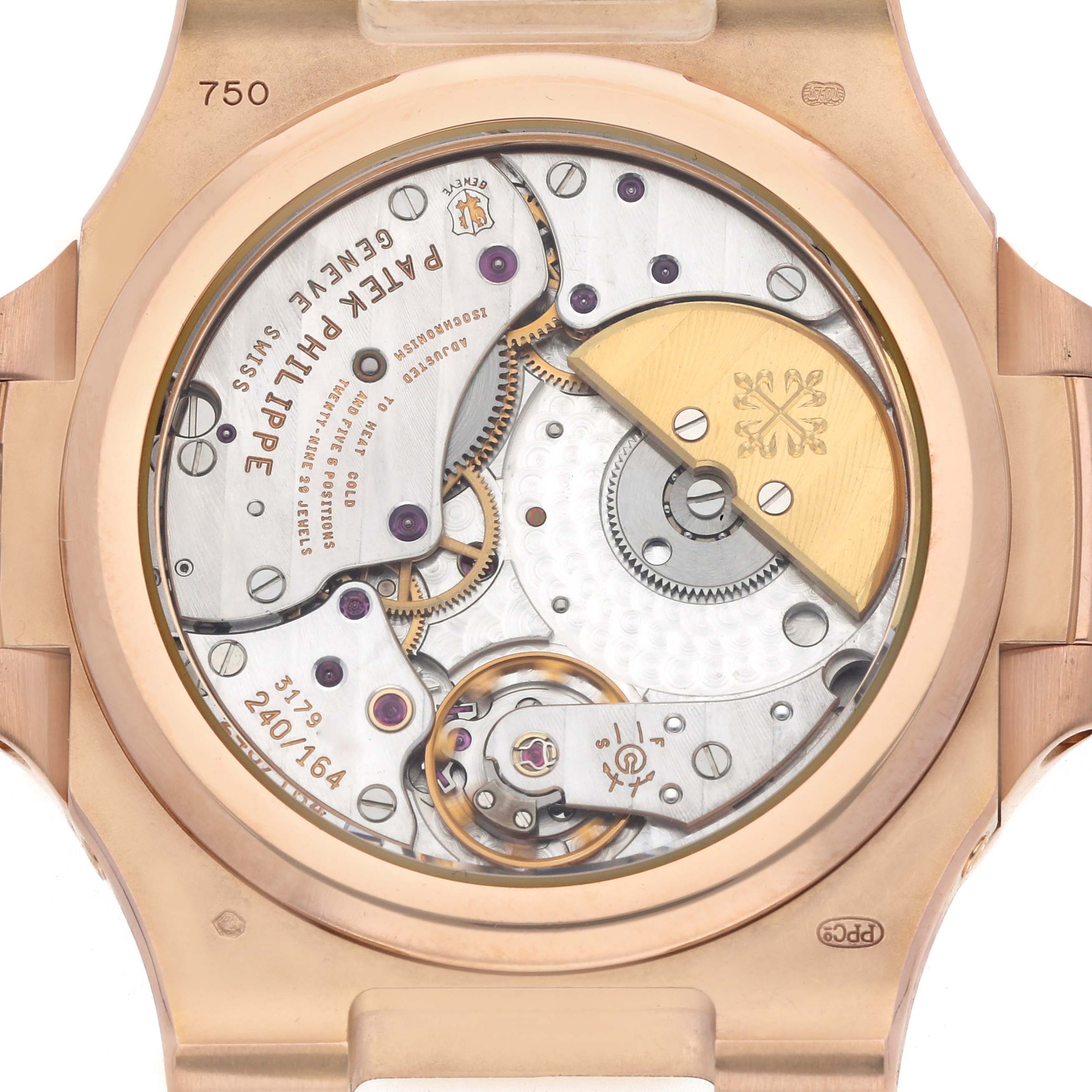 The image shows the back of a Patek Philippe Nautilus 5712R-001 Men's Rose Gold Brown Dial watch, highlighting its movement and intricate mechanical components.