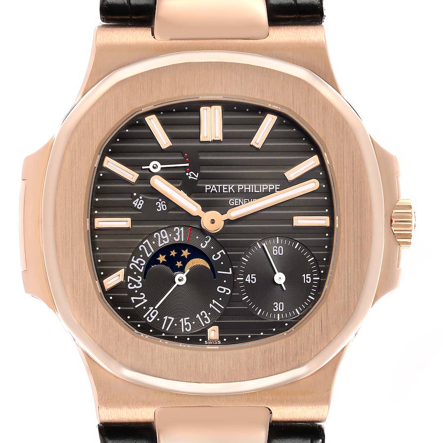 The Patek Philippe Nautilus 5712R-001 Men's Rose Gold Brown Dial is shown from the front, highlighting the dial, subdials, moon phase, and date indicators.