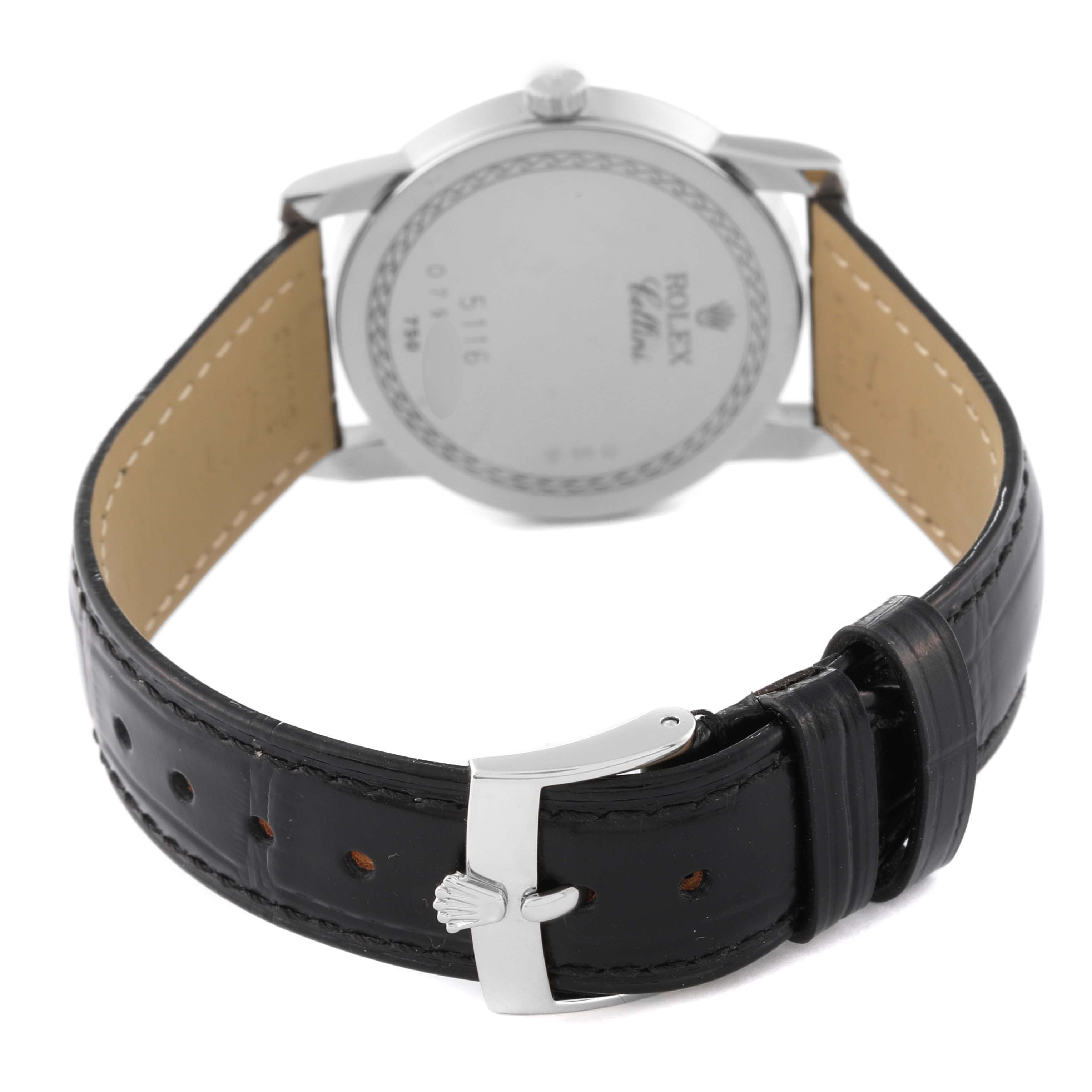The image shows a rear view of a Rolex Cellini 5116 Men's White Gold Grey Dial 5116 Men's White Gold Grey Dial watch featuring its case back and black leather strap with a silver buckle.