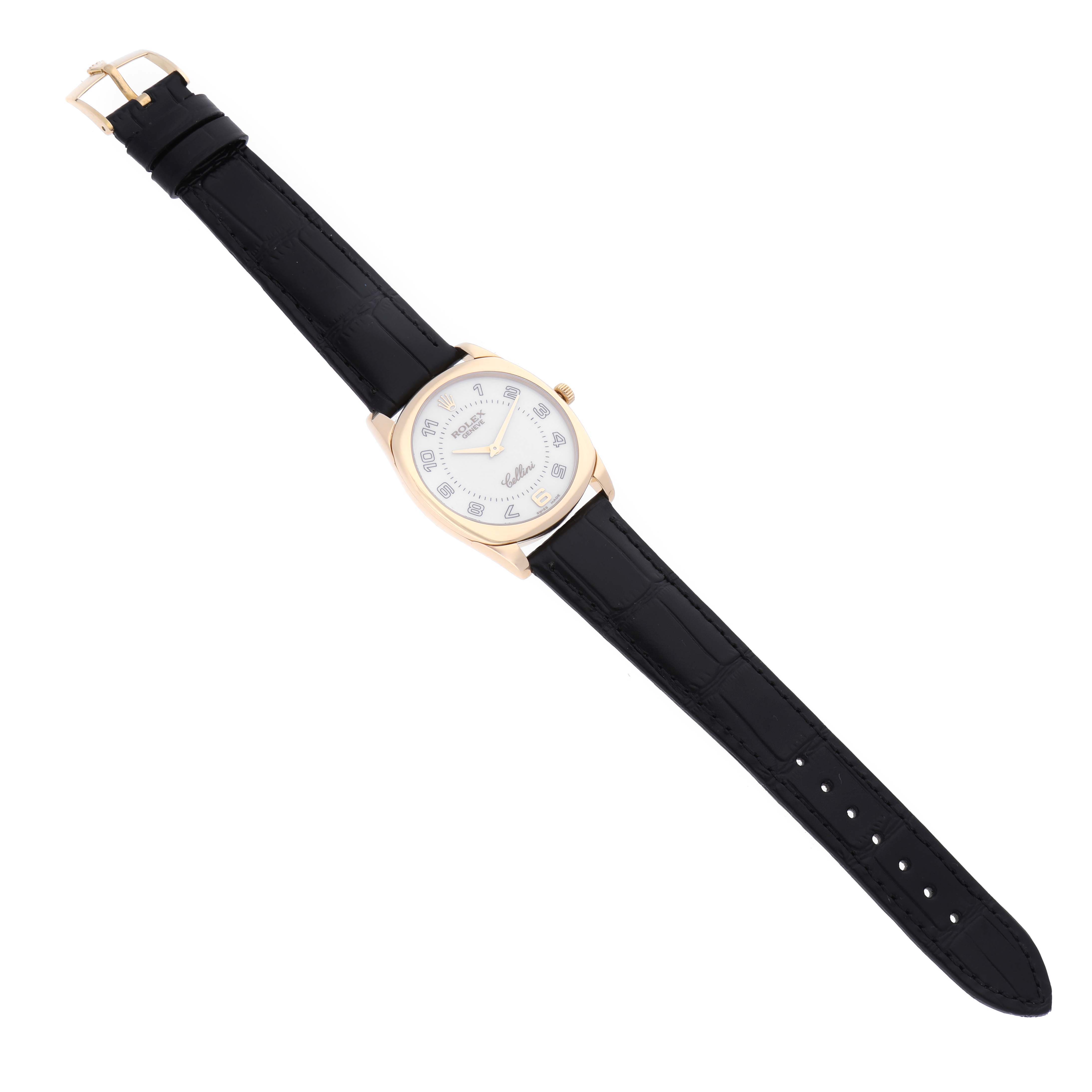 The image shows a top-down view of a Rolex Cellini 4233 Men's Yellow Gold White Dial 4233 Men's Yellow Gold White Dial watch with a black leather strap and a silver round dial.