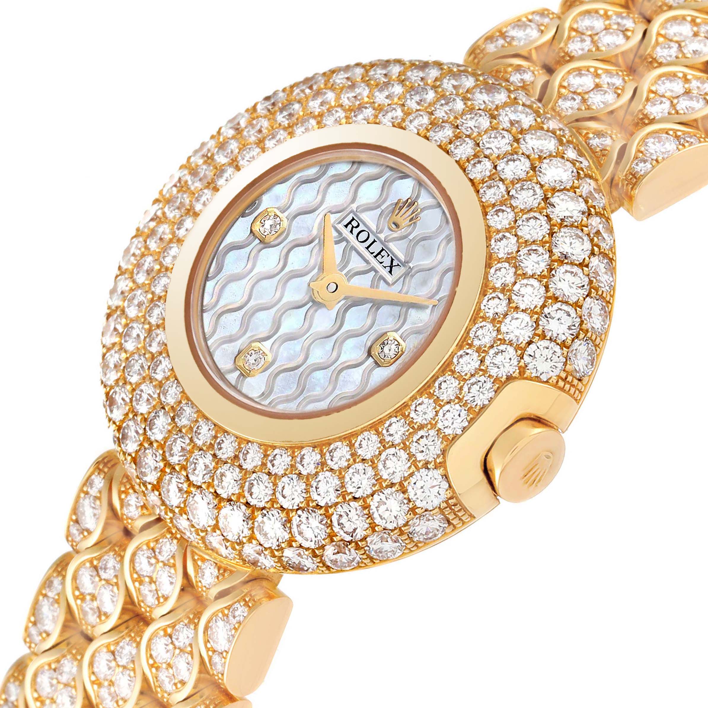 The image shows a close-up of a Rolex Cellini 6221/8 Women's Yellow Gold Mother of Pearl Dial 6221/8 Women's Yellow Gold Mother of Pearl Dial watch, highlighting its diamond-studded bezel, mother-of-pearl dial, and integrated bracelet.