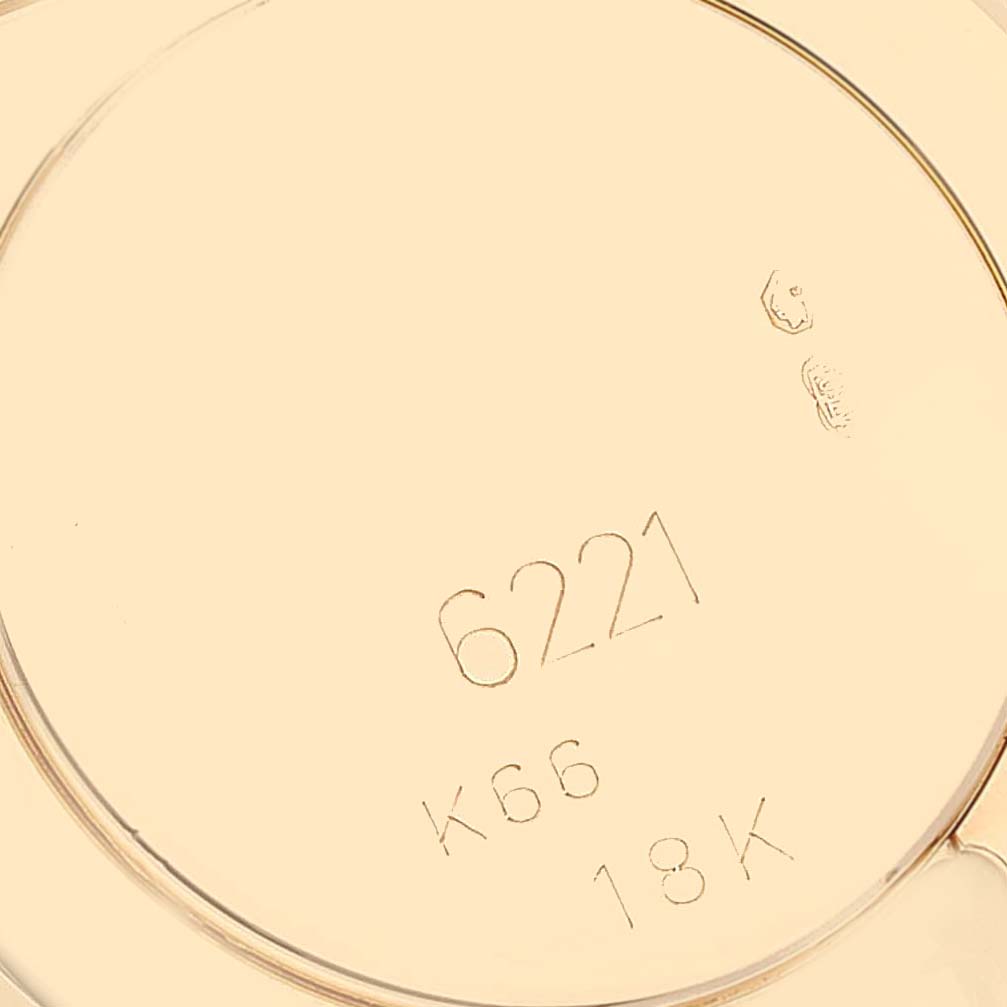 This image shows the case back of a Rolex Cellini 6221/8 Women's Yellow Gold Mother of Pearl Dial 6221/8 Women's Yellow Gold Mother of Pearl Dial watch, highlighting its model number 6221 and 18K gold marking.